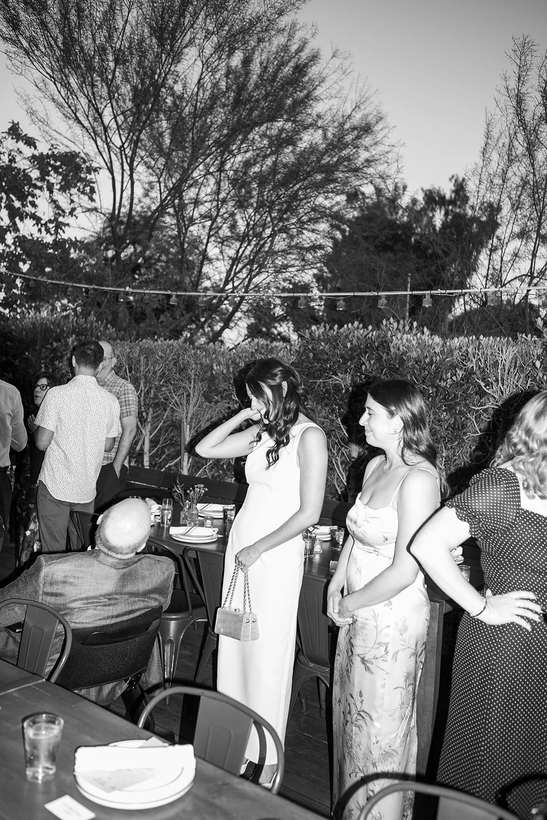 Bride talking with wedding guests