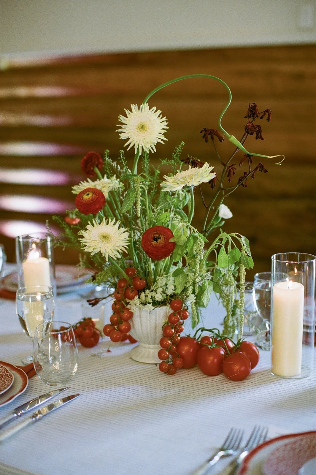 Table floral arrangement with candles lit