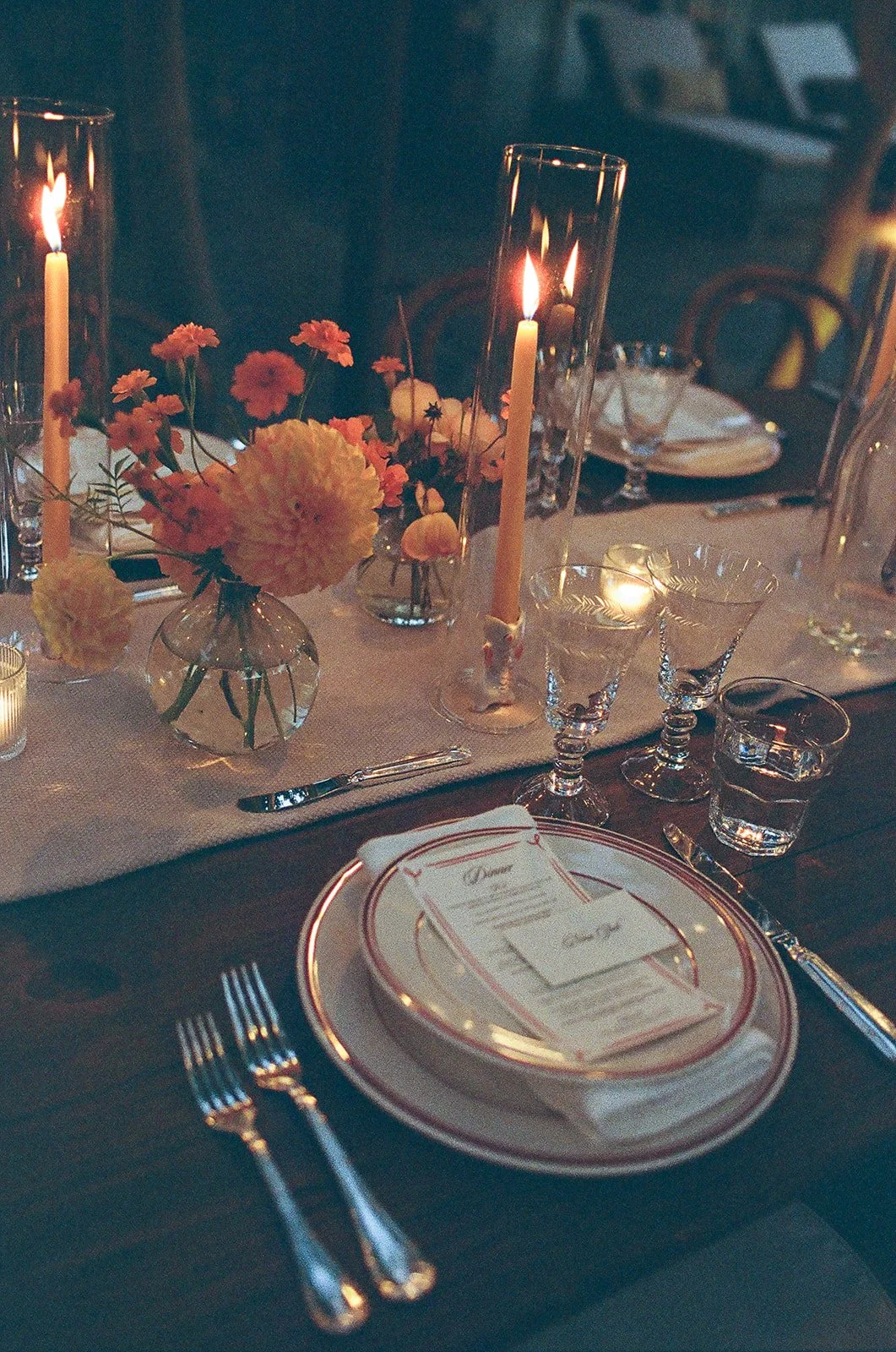 Dinner table at dusk with candles lit