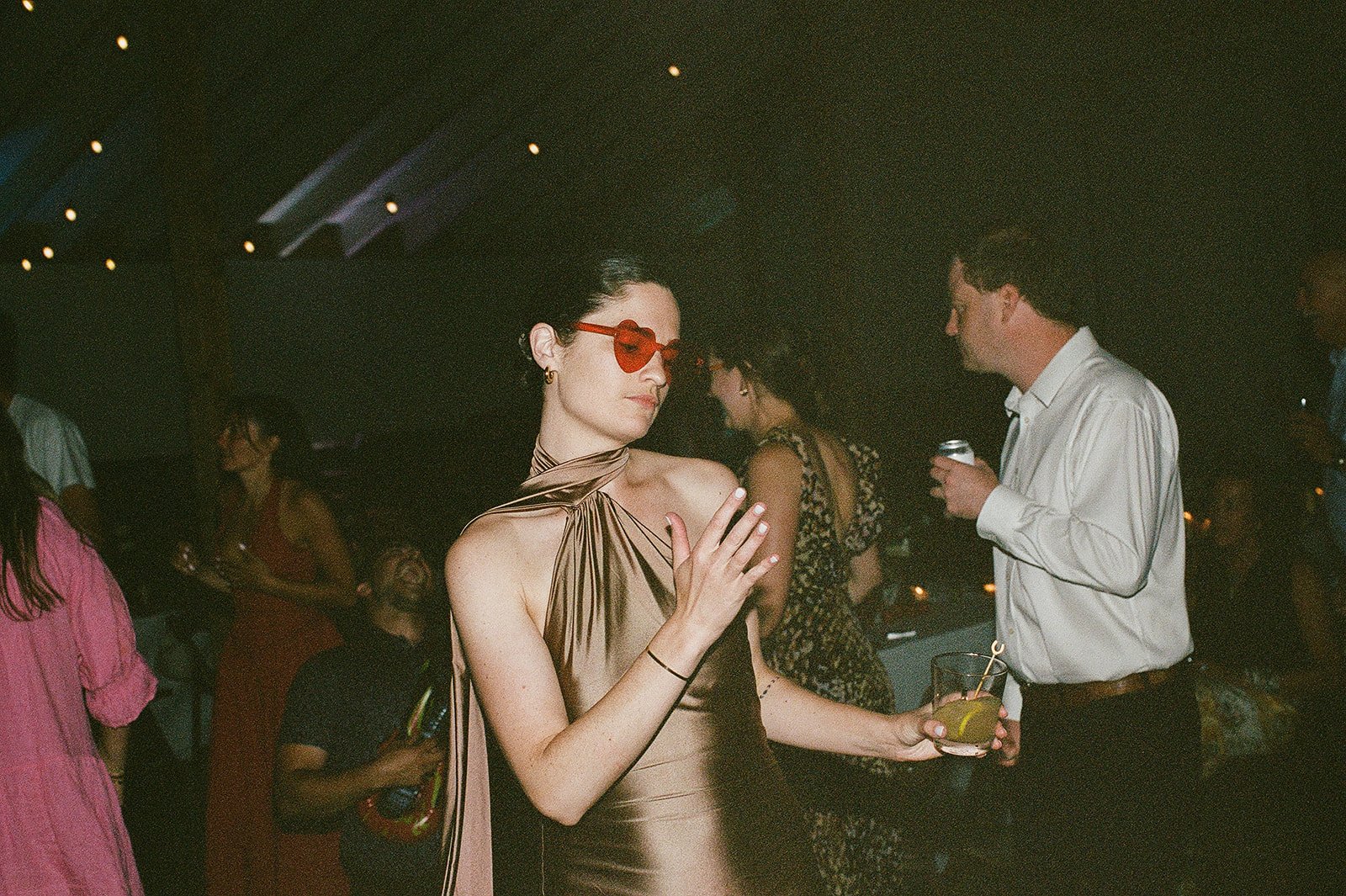 Guest wearing heart sunglasses dancing