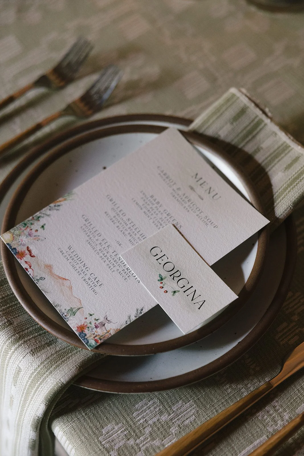 Wedding dinner menu and name card on plate and napkin