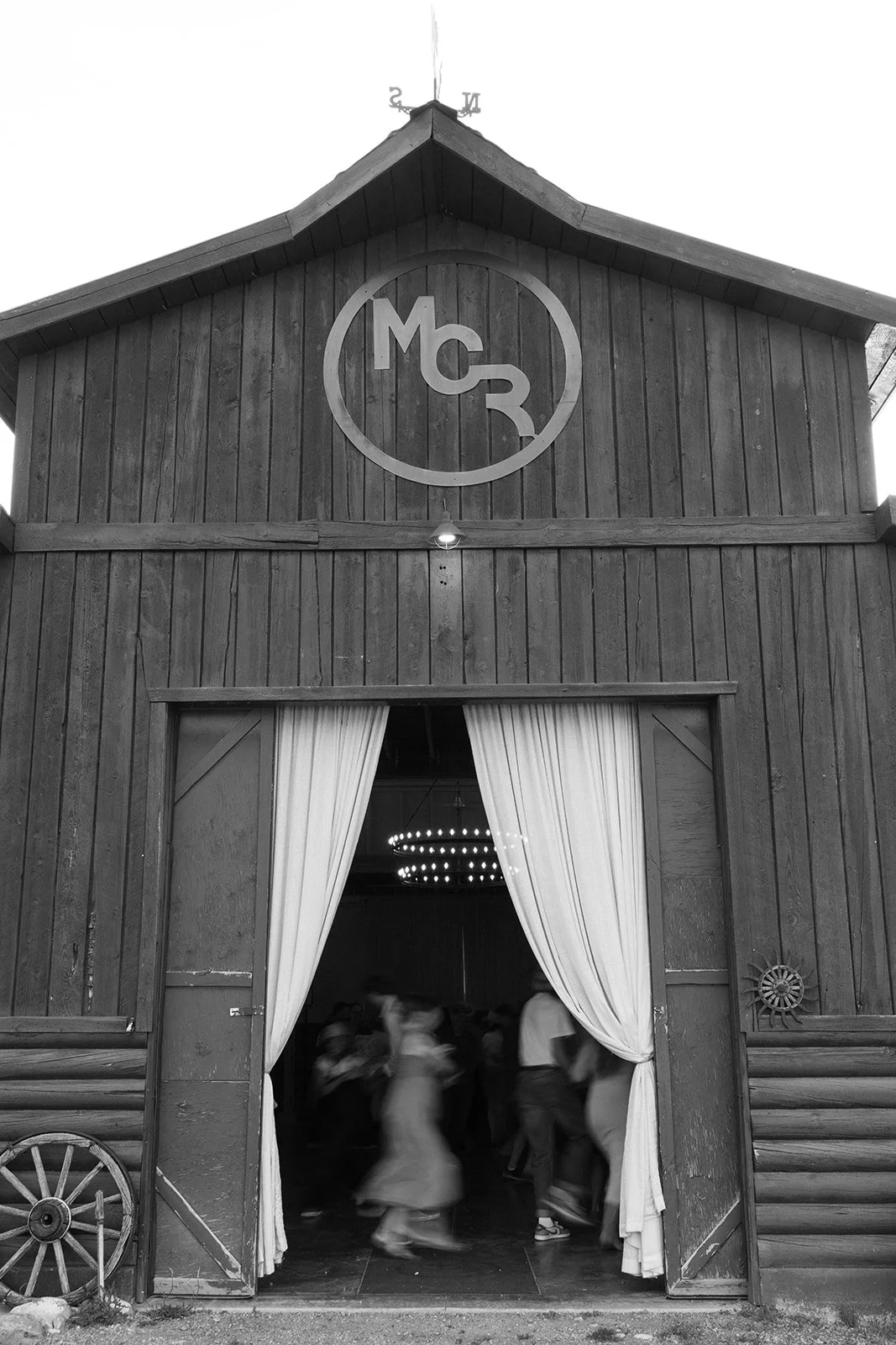 Guests dancing inside of Moose Creek barn