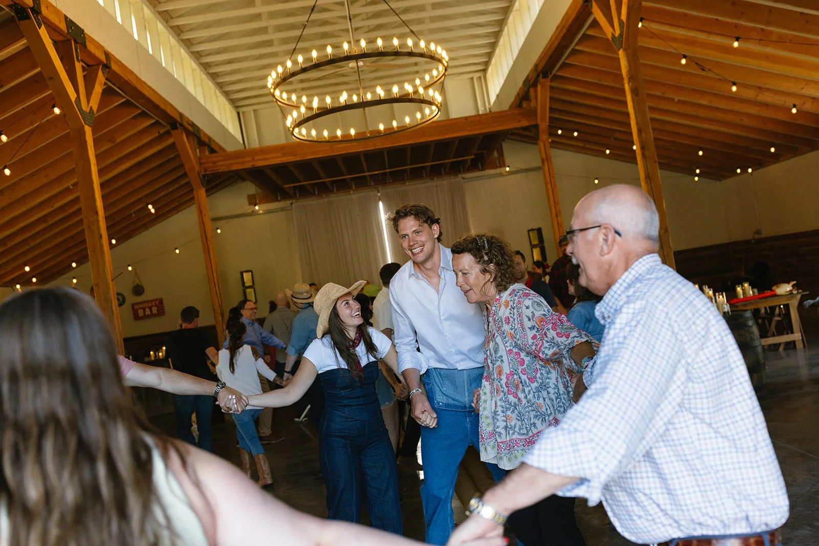 Guests holding hands while dancing in a circle
