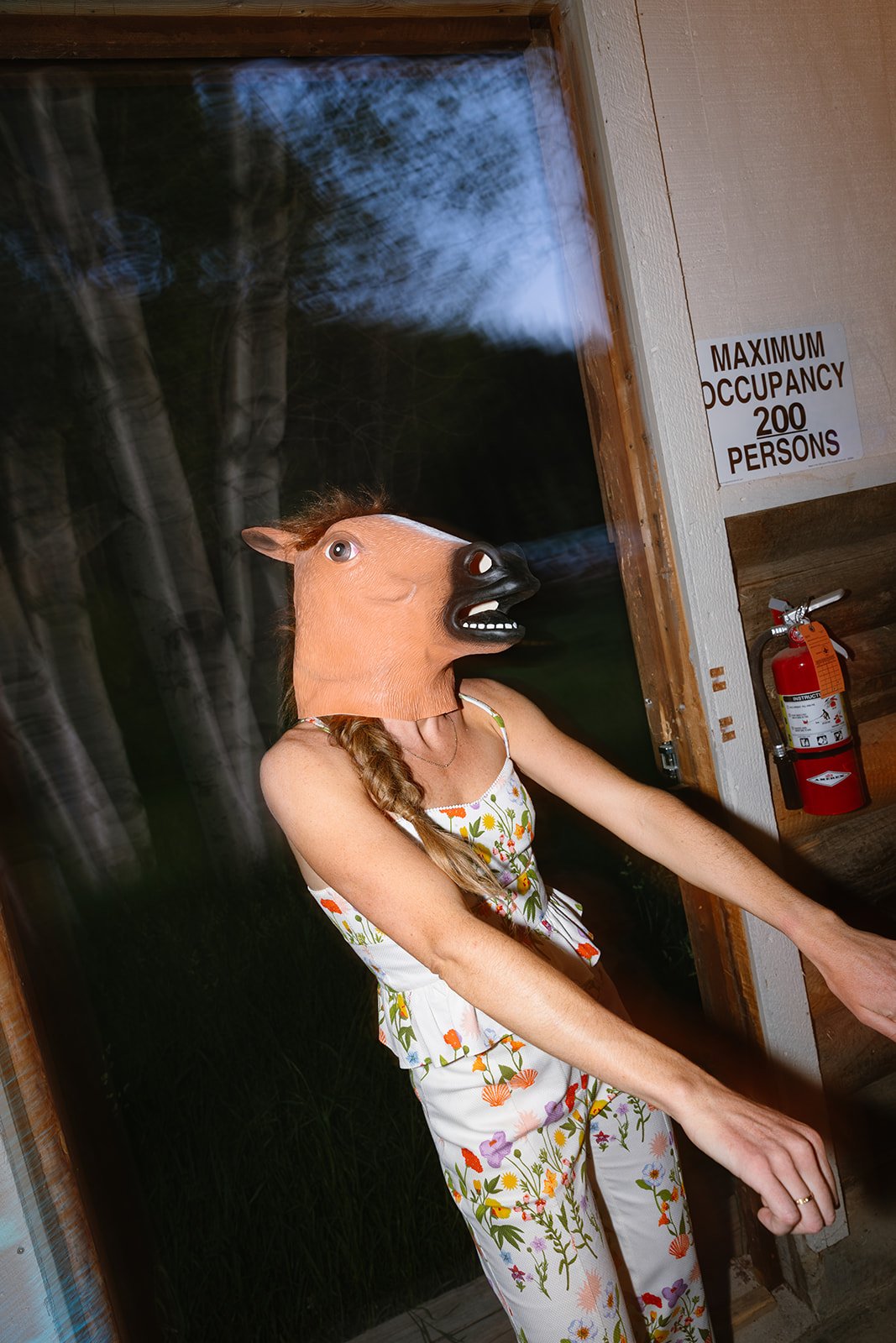 Bride wearing horse head mask