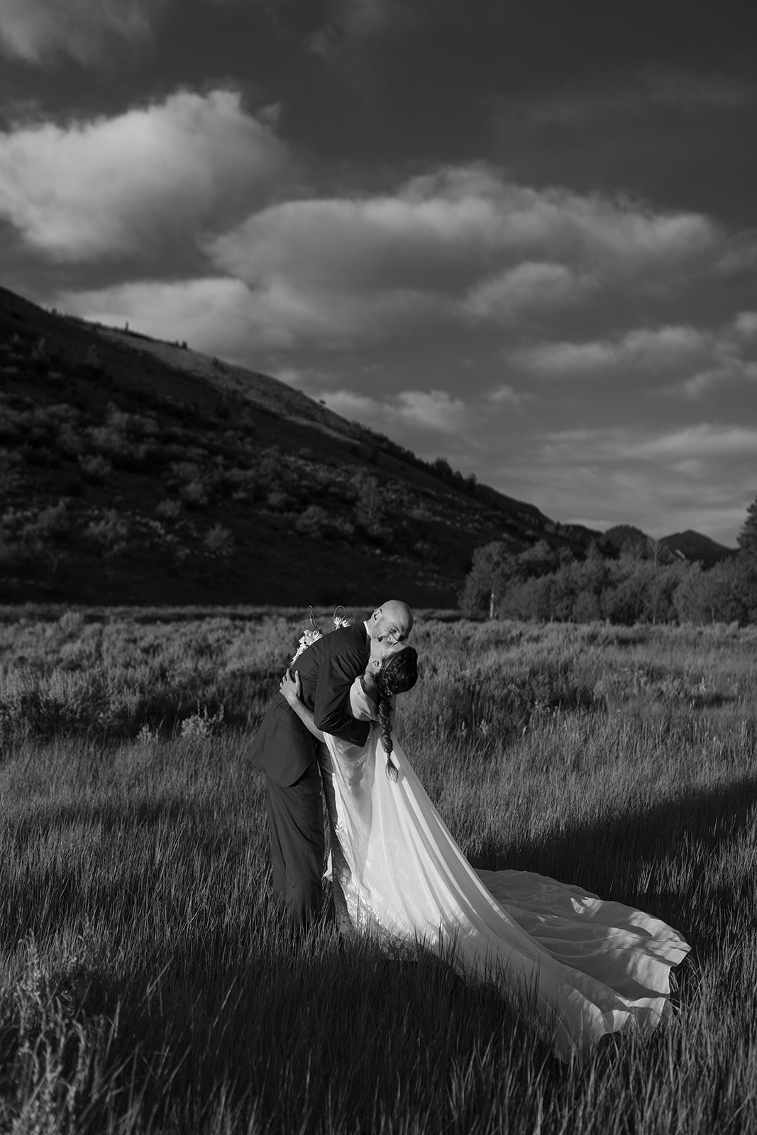 Bride and groom embracing and laughing