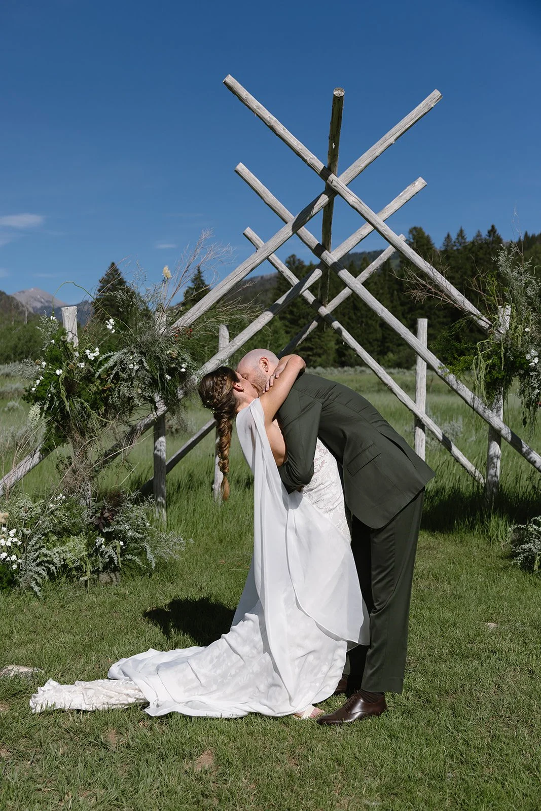 Bride and groom hugging at altar