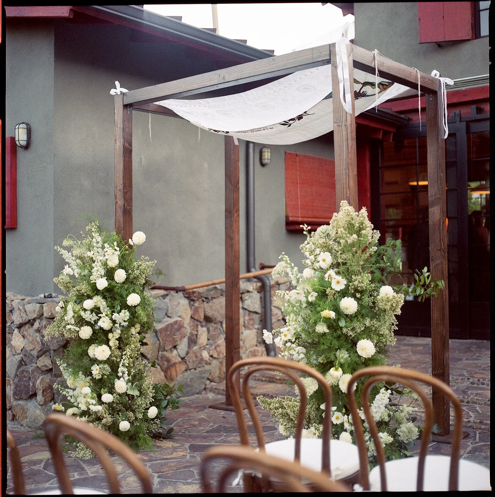 Chuppah with florals around it