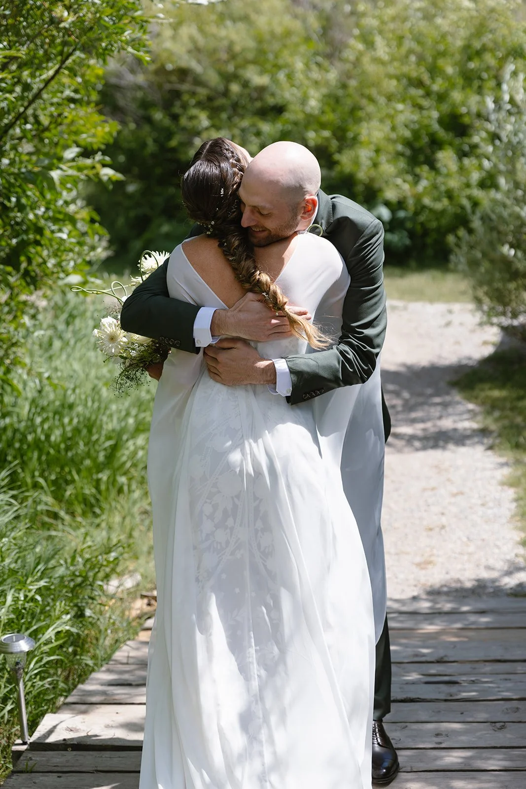 Bride and groom hugging