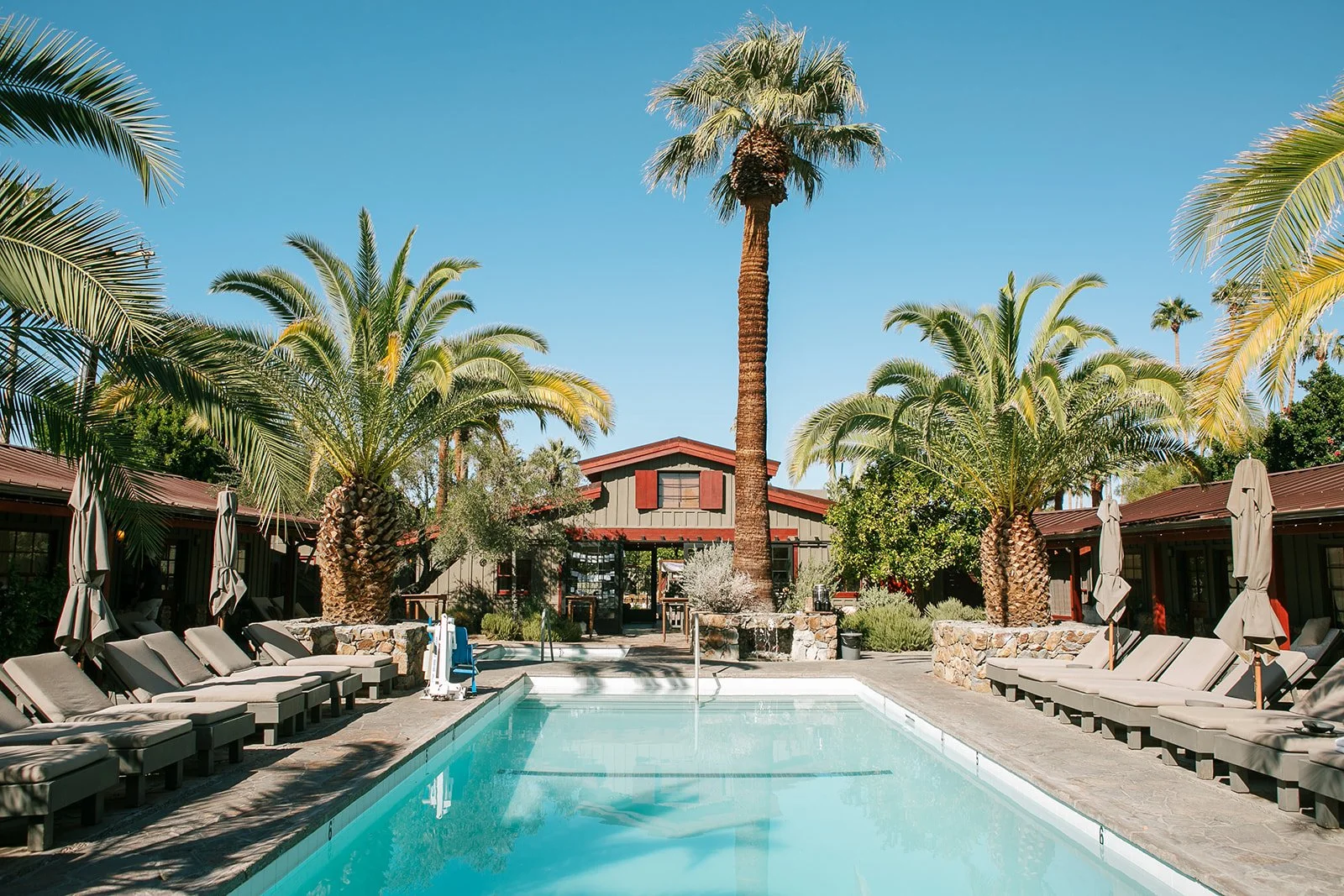 Pool outside of boutique barn hotel