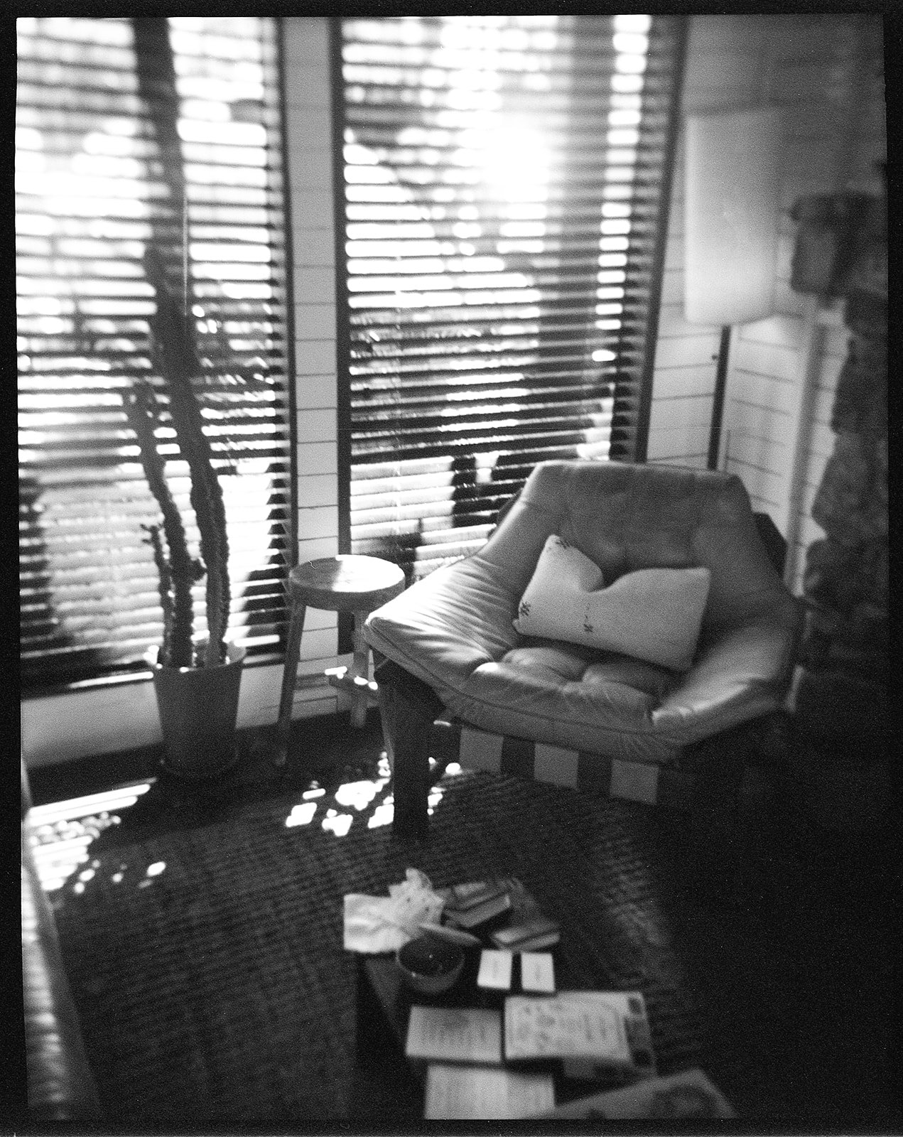Darkened room with wedding invitation suite on table