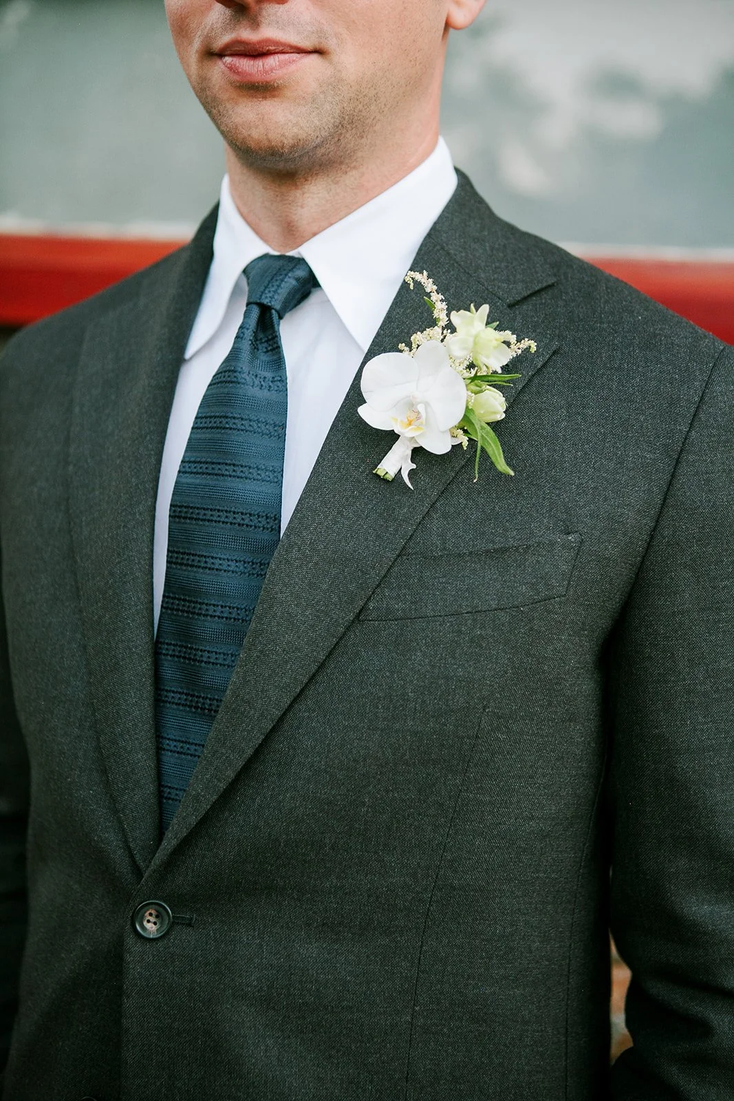 Groom with suit and boutonniere on
