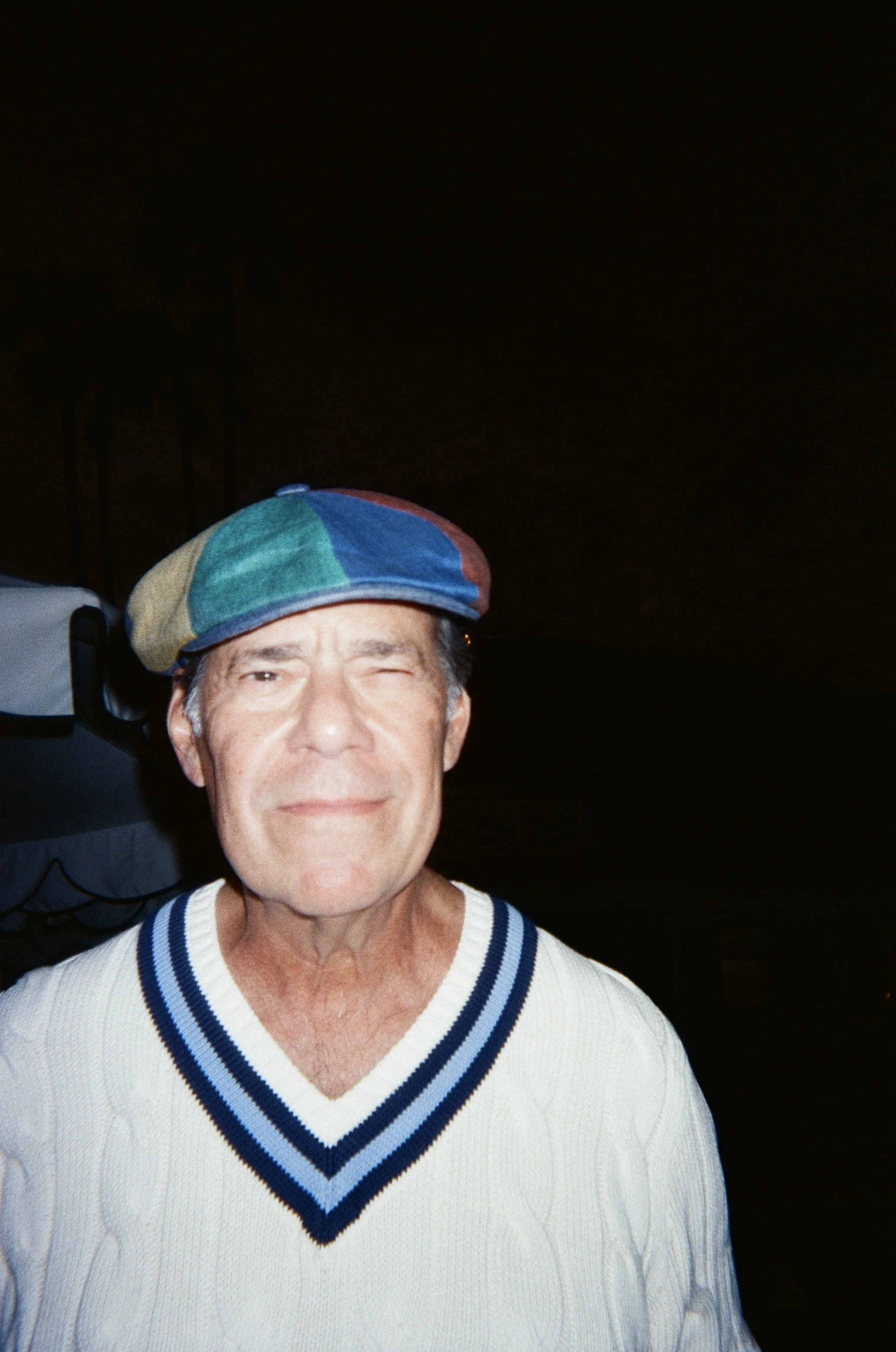 Wedding guest with traditional golf hat at welcome party