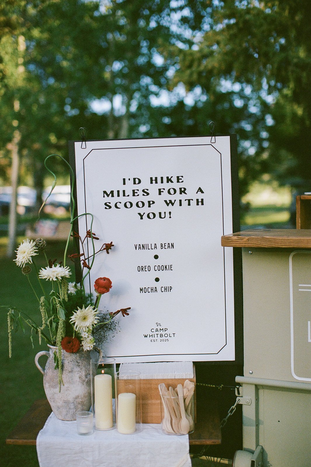 Ice cream dessert sign with florals around it