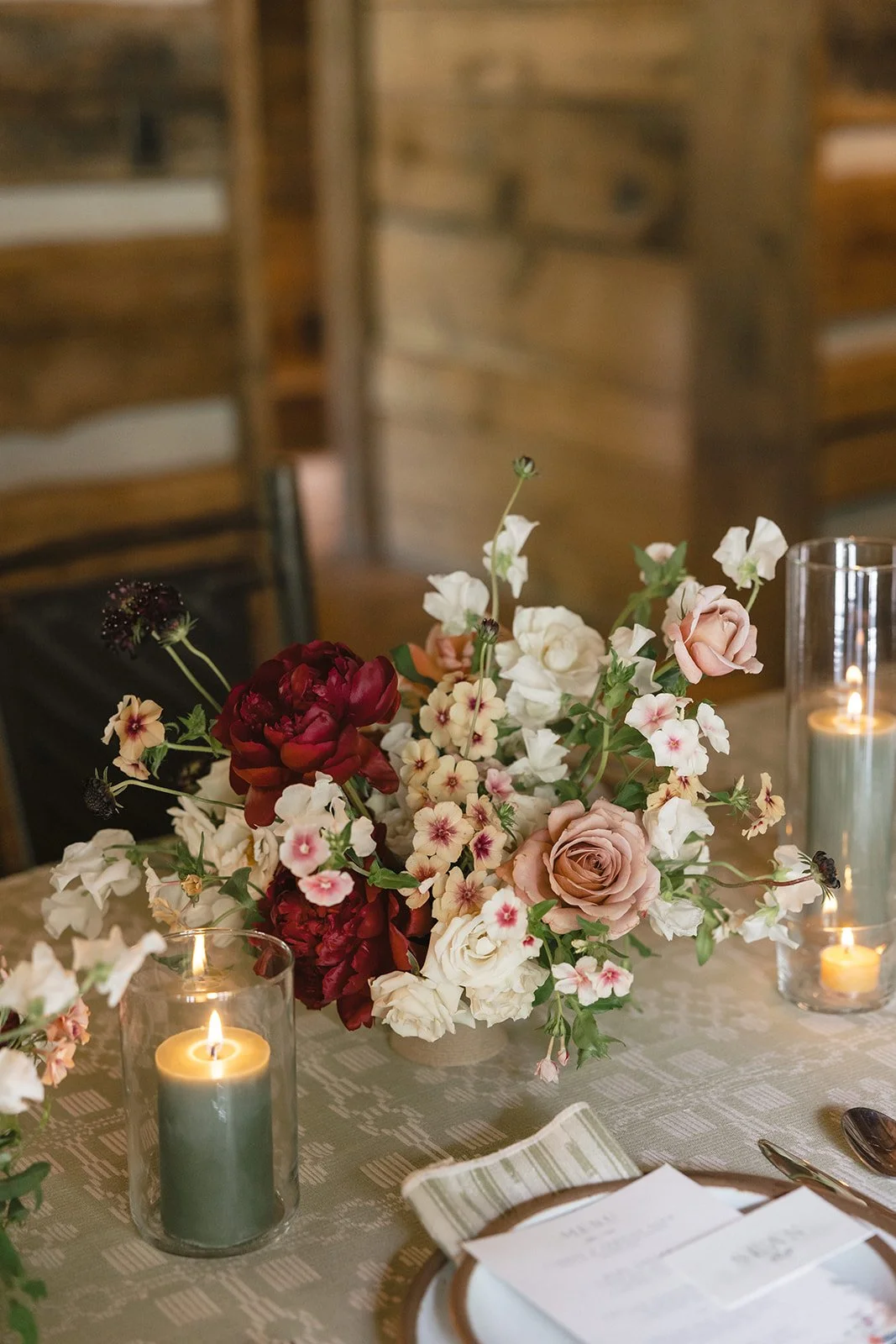Floral bouquet at wedding dinner table