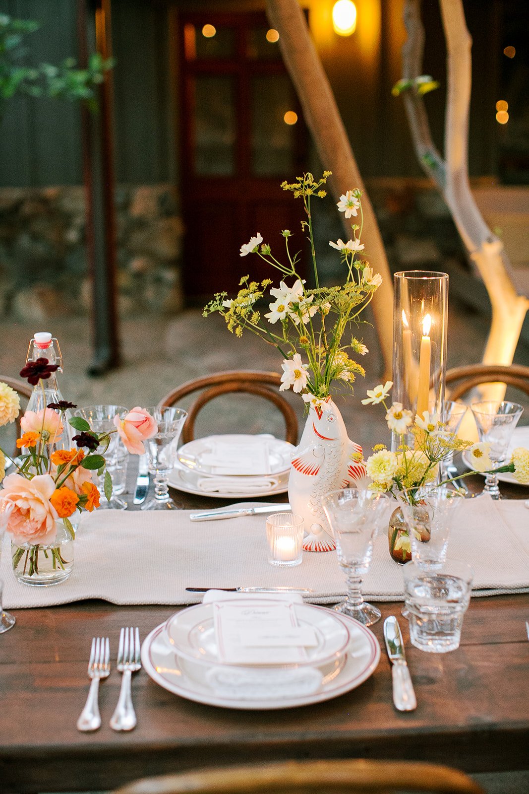 Table scape with florals in fish shaped vases