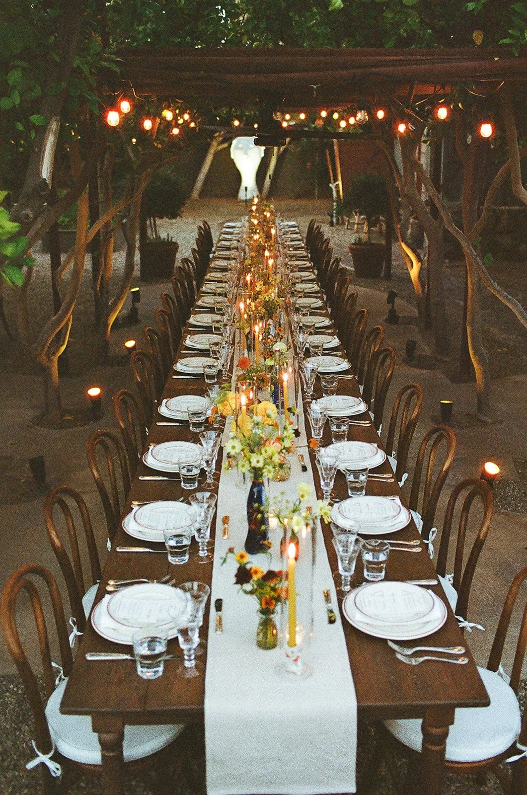 Looking down table with all place settings ready