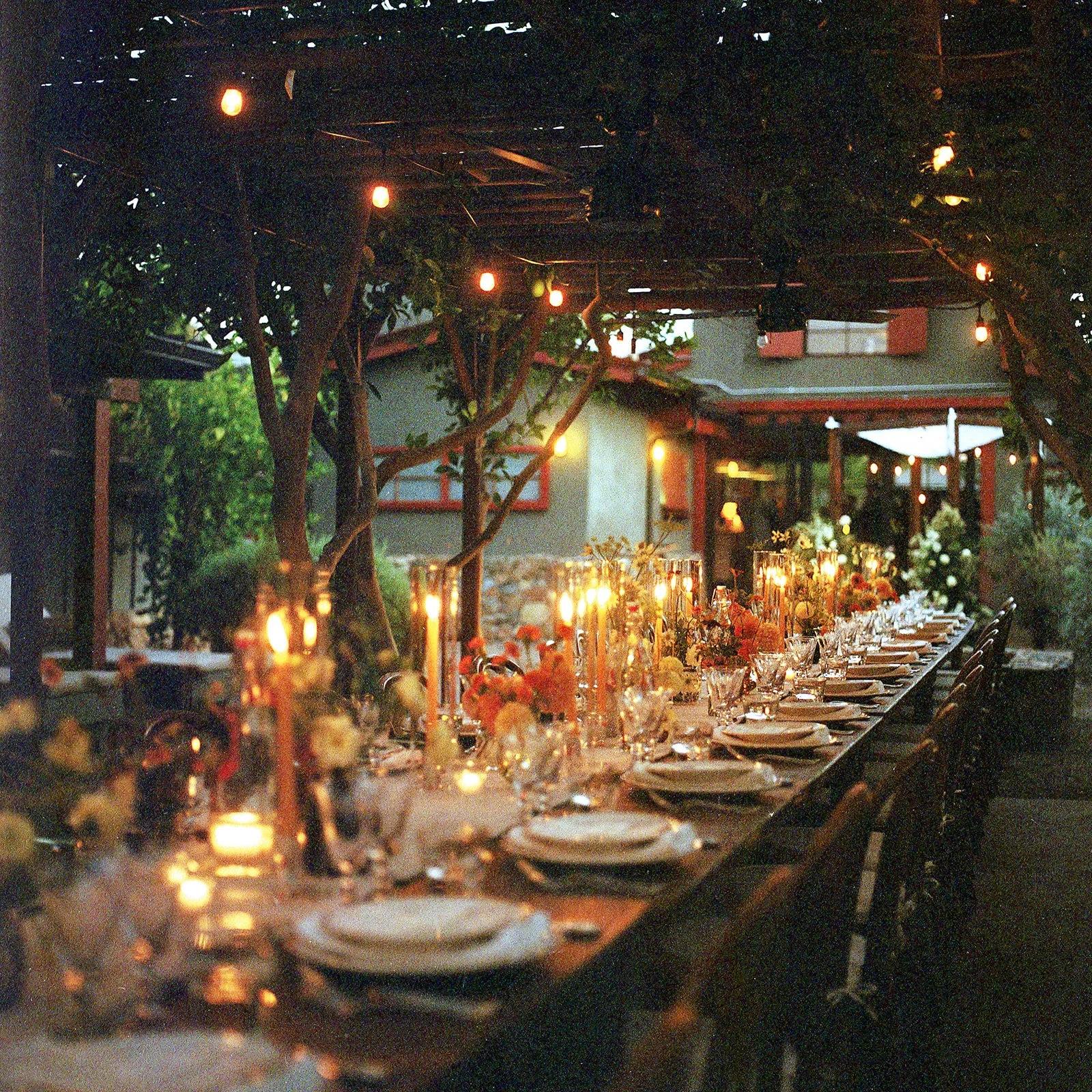 Table set at dusk with candles lit