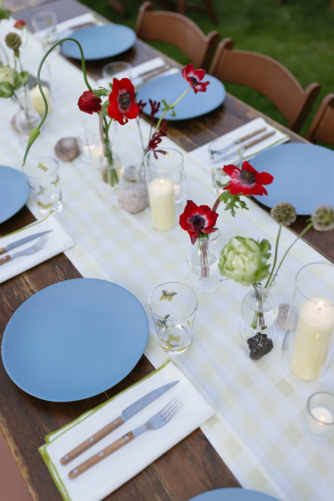 Overhead of tablescape with blue plates, red and green florals