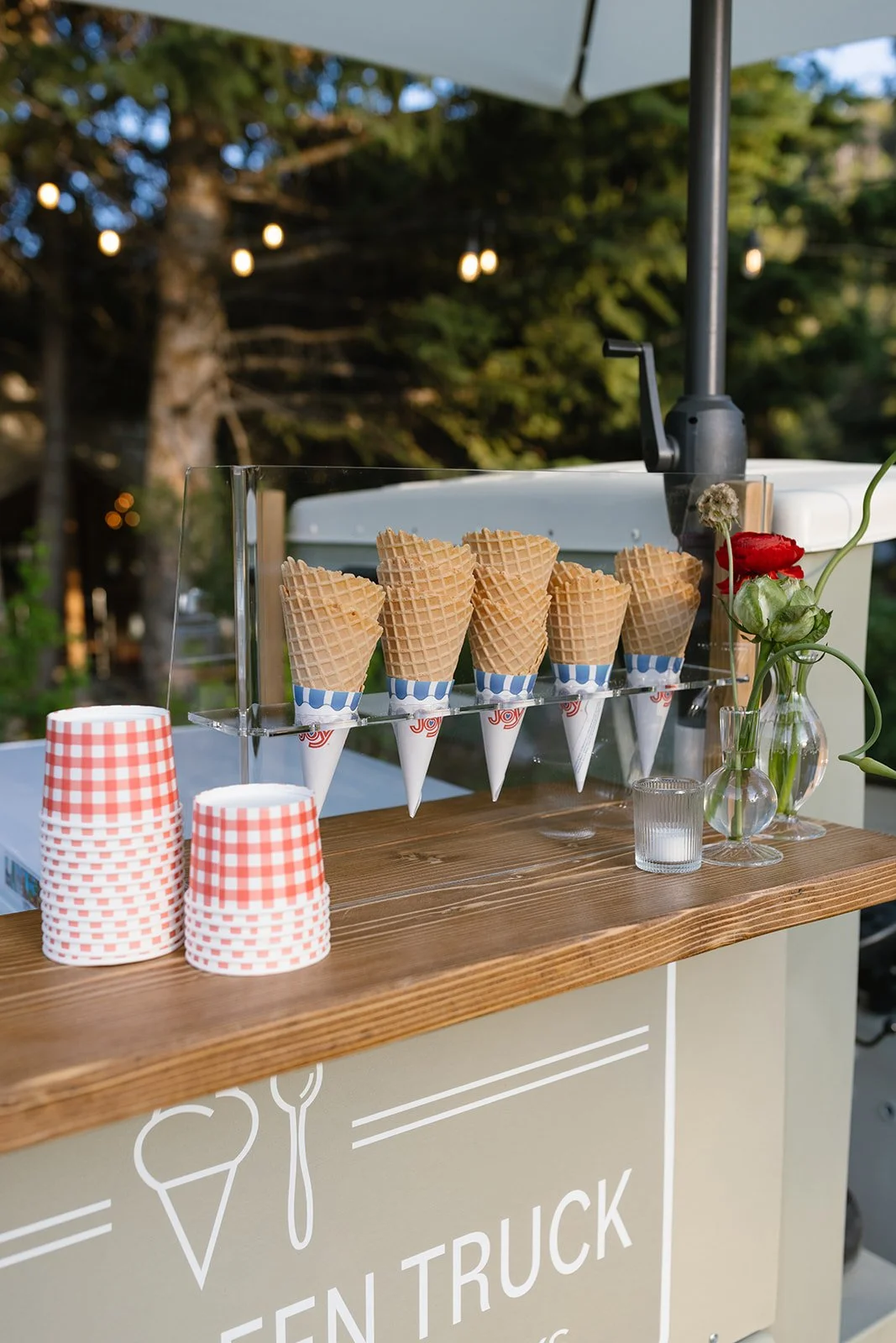 Ice cream cones and cups on ice cream truck stand
