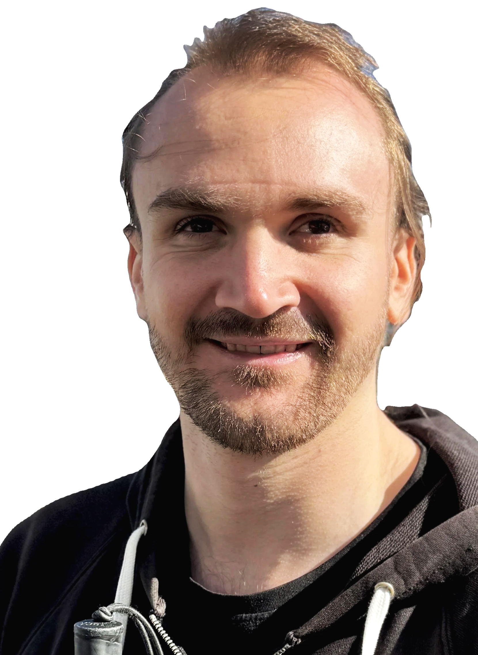 Quite a close up photo of Thomas, he is smiling.