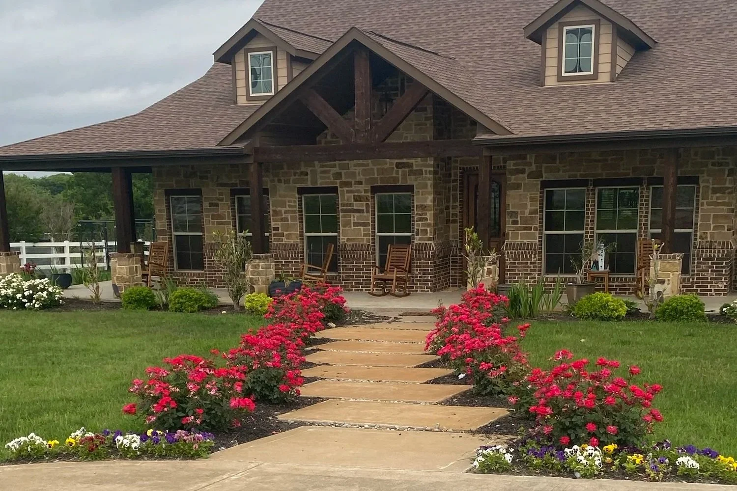 Rose-lined walkway landscaping by Leatherneck Landscaping