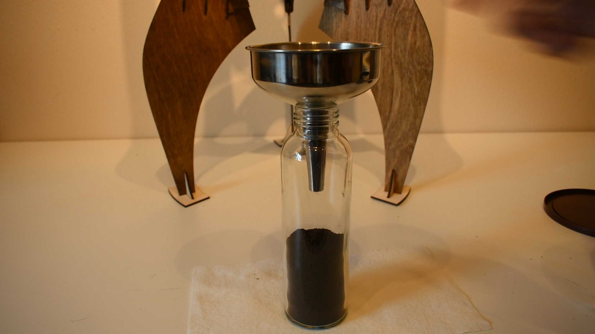 Filling the middle jar with coffee grounds