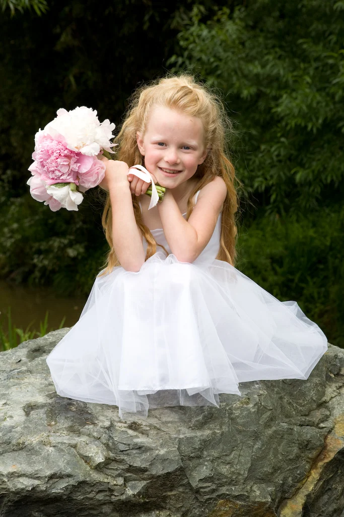 Flowergirl-holding-pink-bouquet-flowerpower-northland