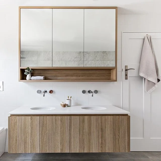 Here is the floating vanity in our Mosman project with mirrored door shaving cabinet. We always try our best to work within our clients budgets without compromising on quality. Instead of drawers in this vanity, the client opted for cupboards as they are a more cost effective solution. Same quality, more affordable price tag!