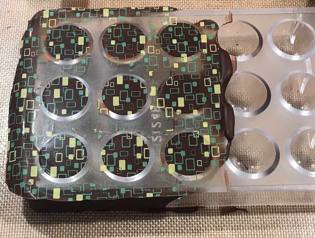 Contact sheet used to imprint a pattern onto the bottom of the truffles.