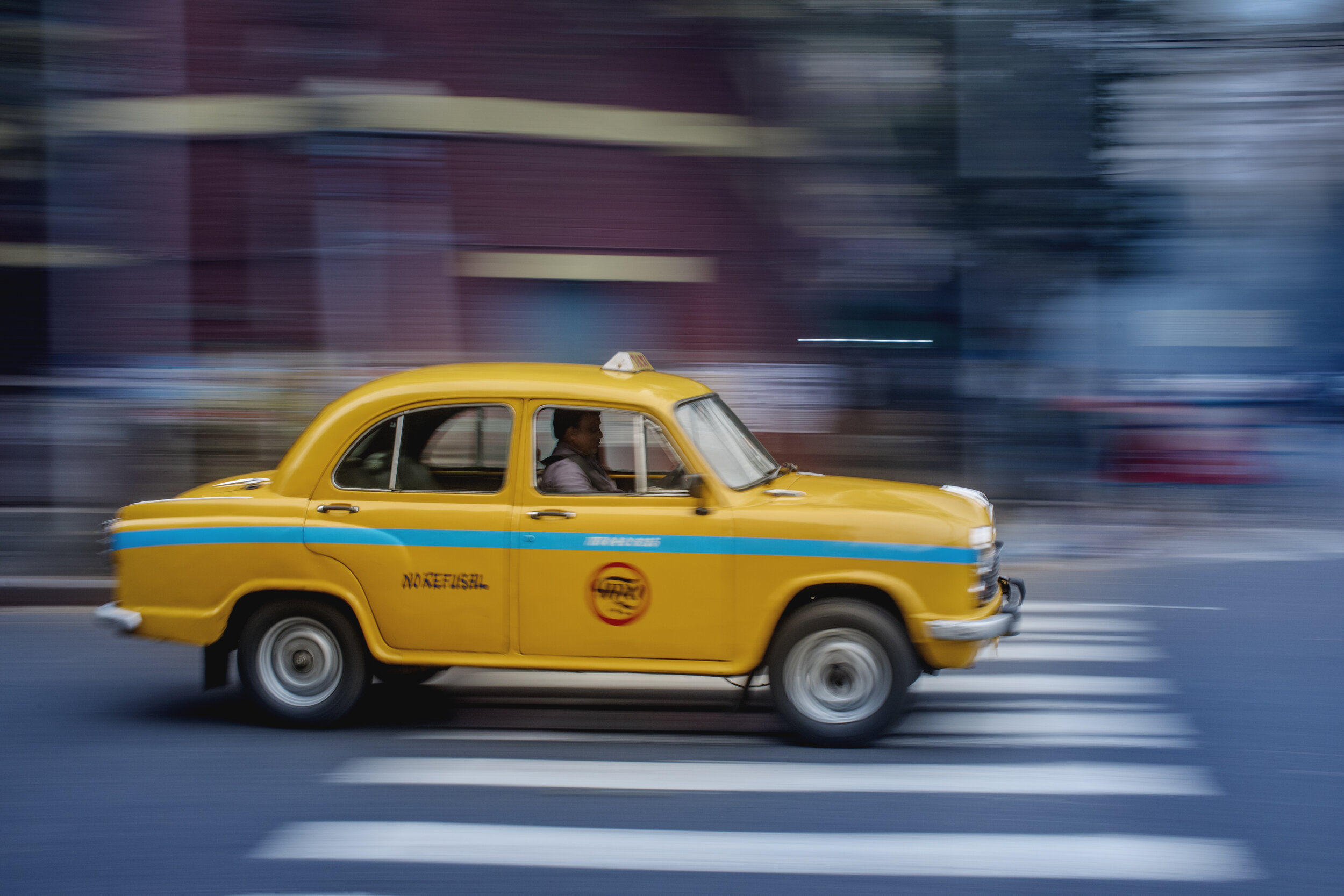  A Hindustan Ambassador taxi driving on the streets of Calcutta/ India. 