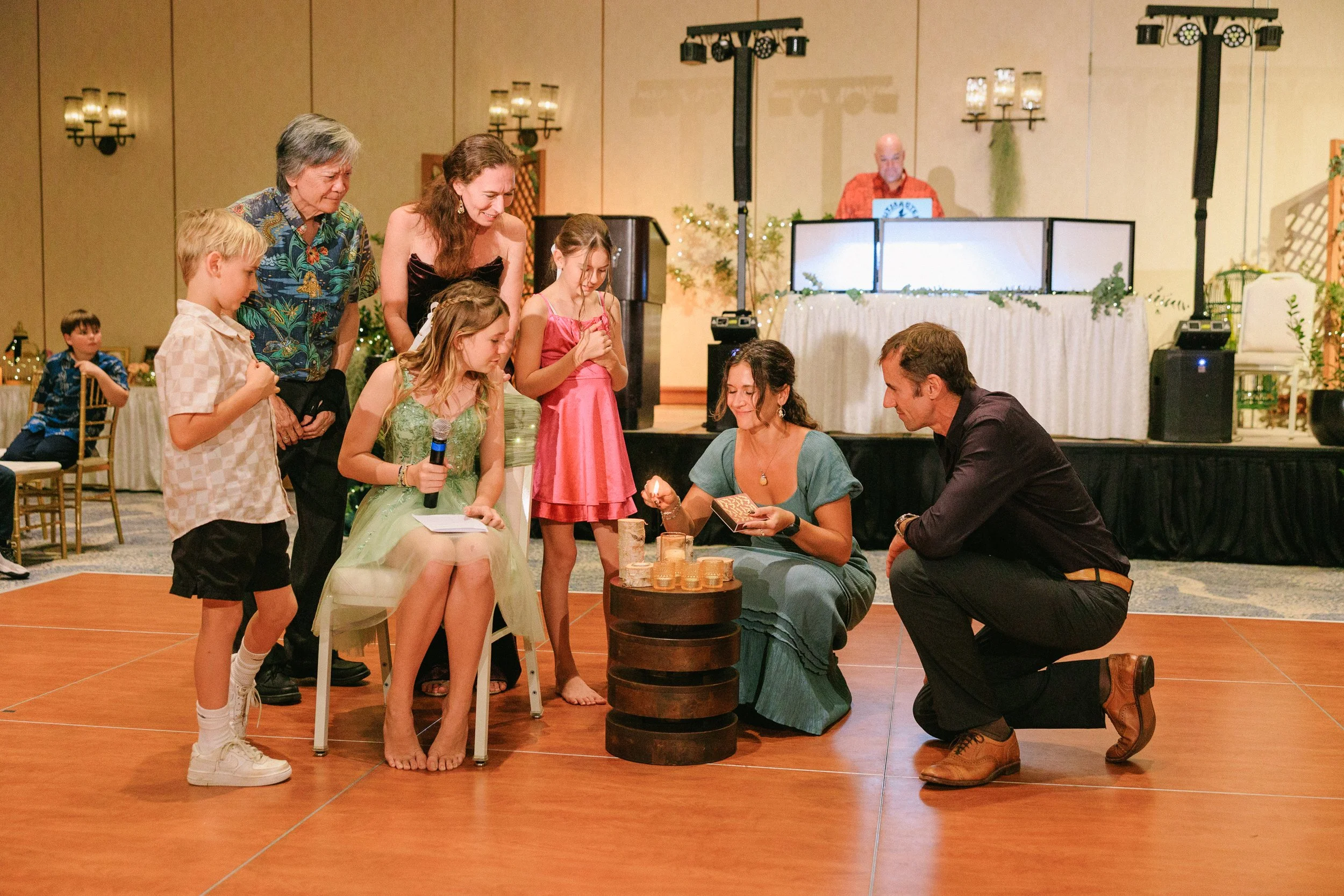 family celebrating with their daughter at a bat mitzvah reception in Waikiki