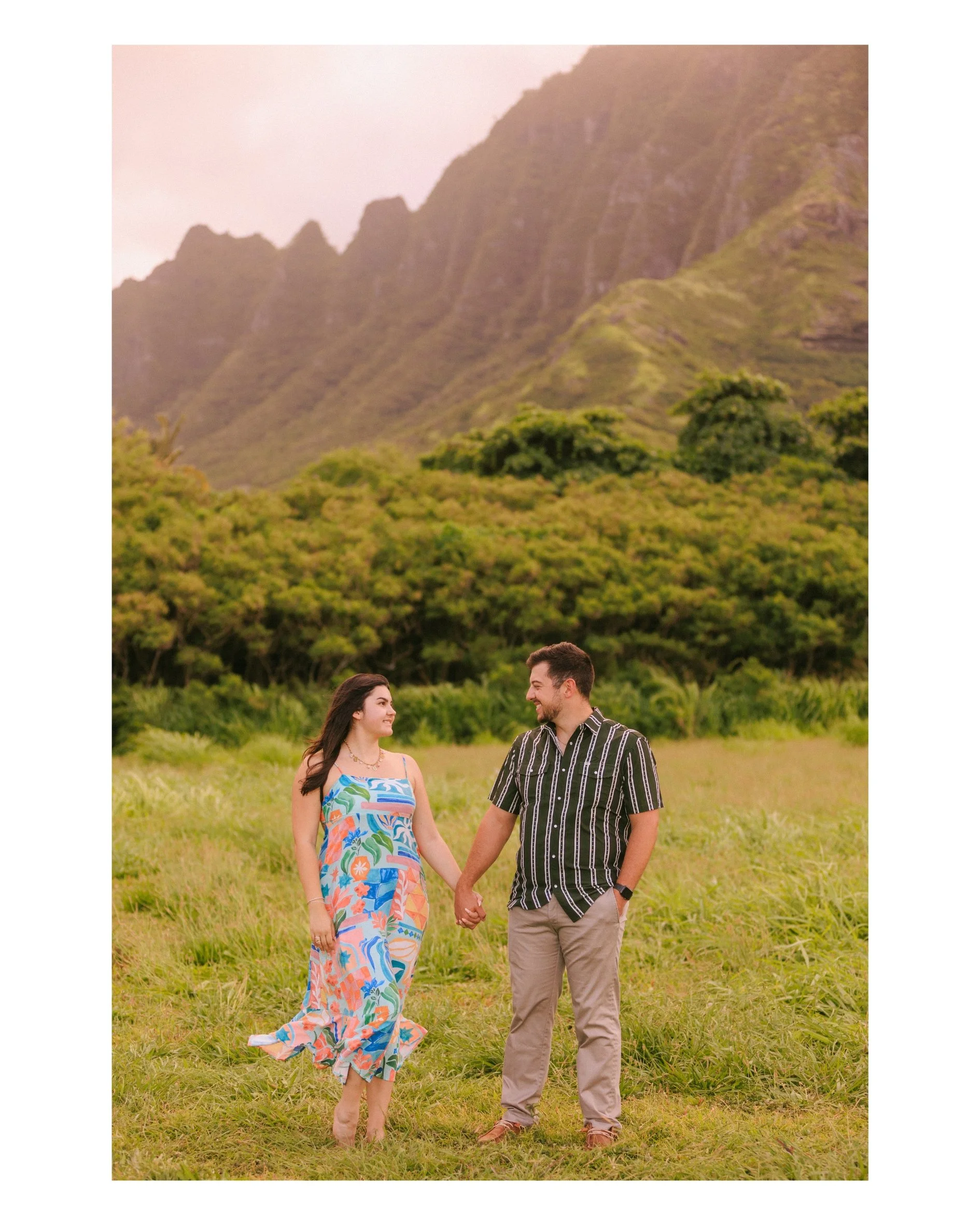 Surprise proposal at Kualoa Regional Park on Oahu with Jake proposing to Sloane at sunset beneath the Koʻolau Mountains. Emotional Hawaii engagement moment captured by an Oahu proposal photographer.