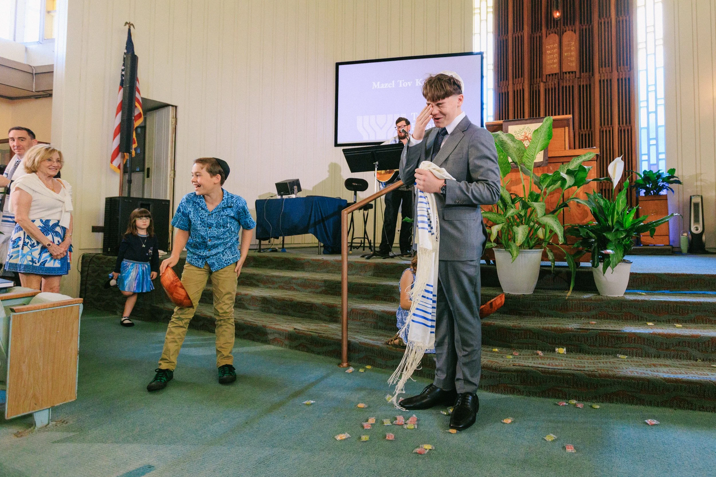 guests throwing candy during bar mitzvah tradition Honolulu synagogue