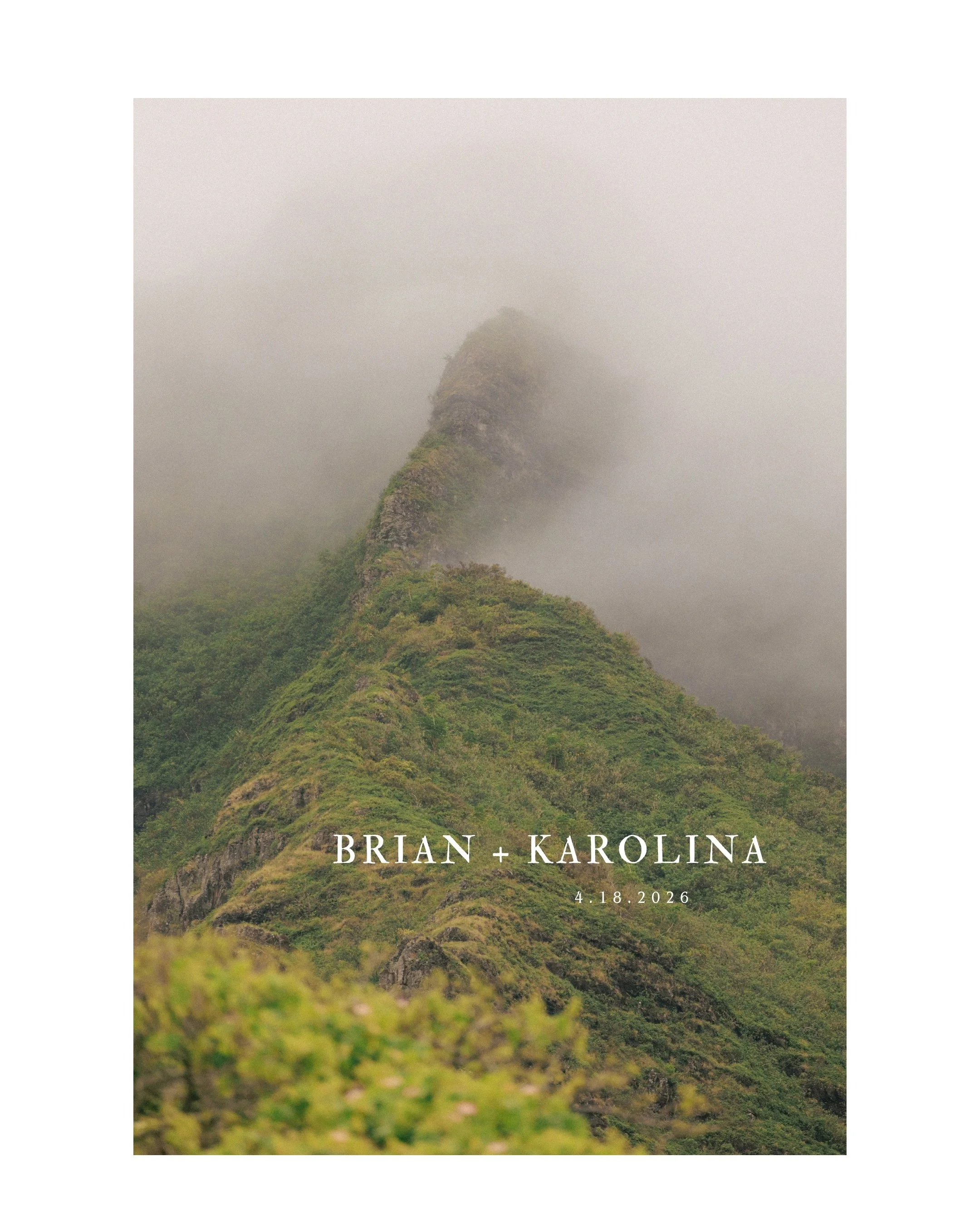 Misty green Koʻolau mountains covered in clouds at Kualoa Ranch wedding venue on Oahu Hawaii before morning elopement ceremony.