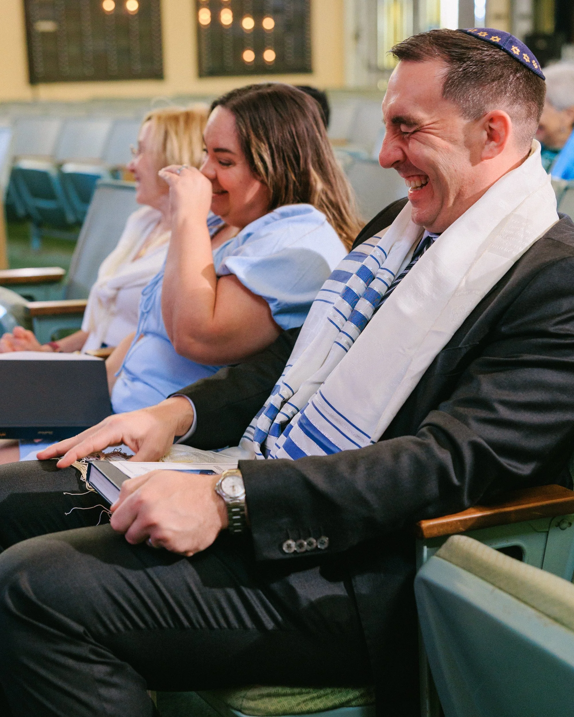 close up candid moment of laughing during bar mitzvah service Oahu Hawaii