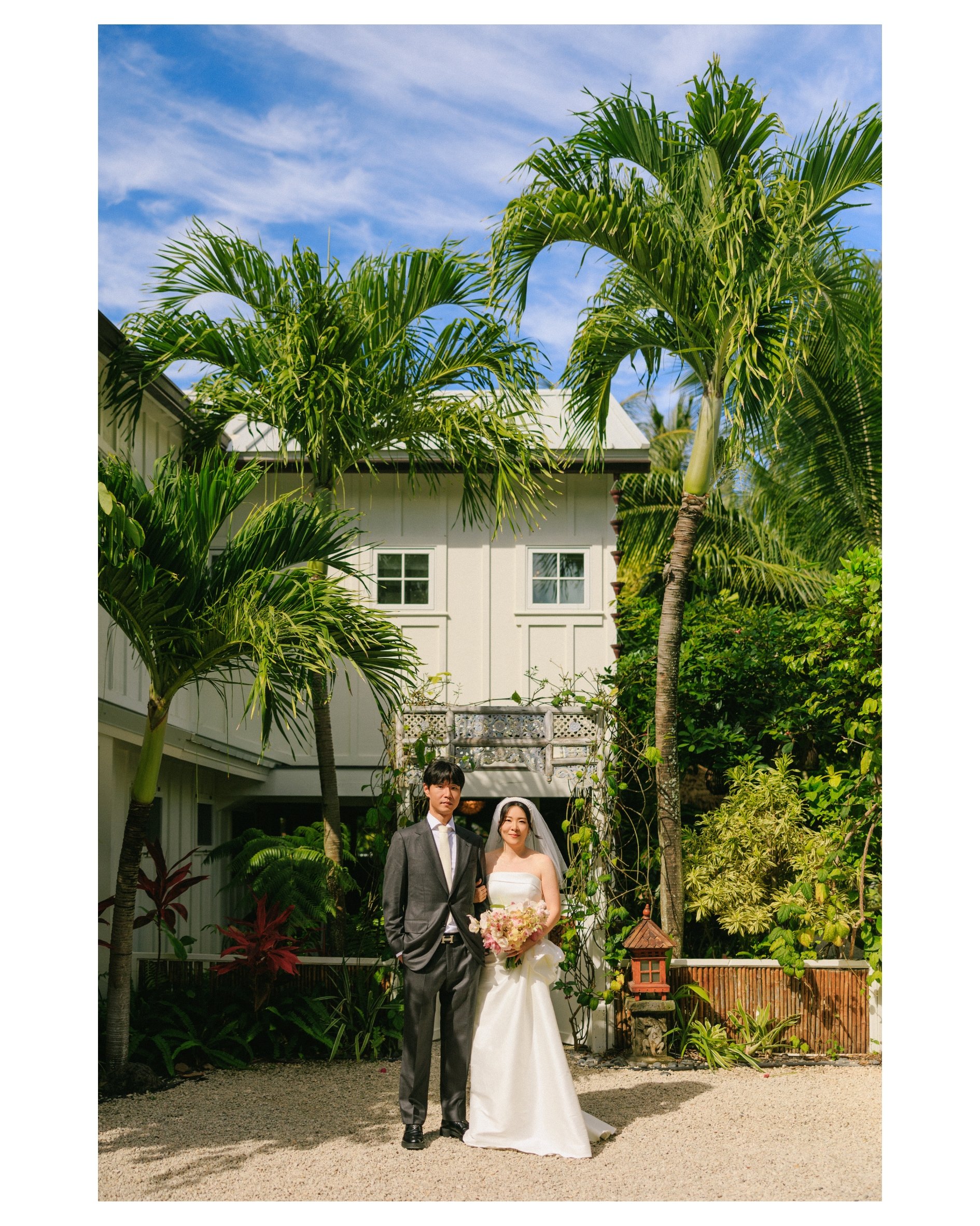 Intimate wedding ceremony at Male'ana Gardens surrounded by lush tropical gardens on Oahu