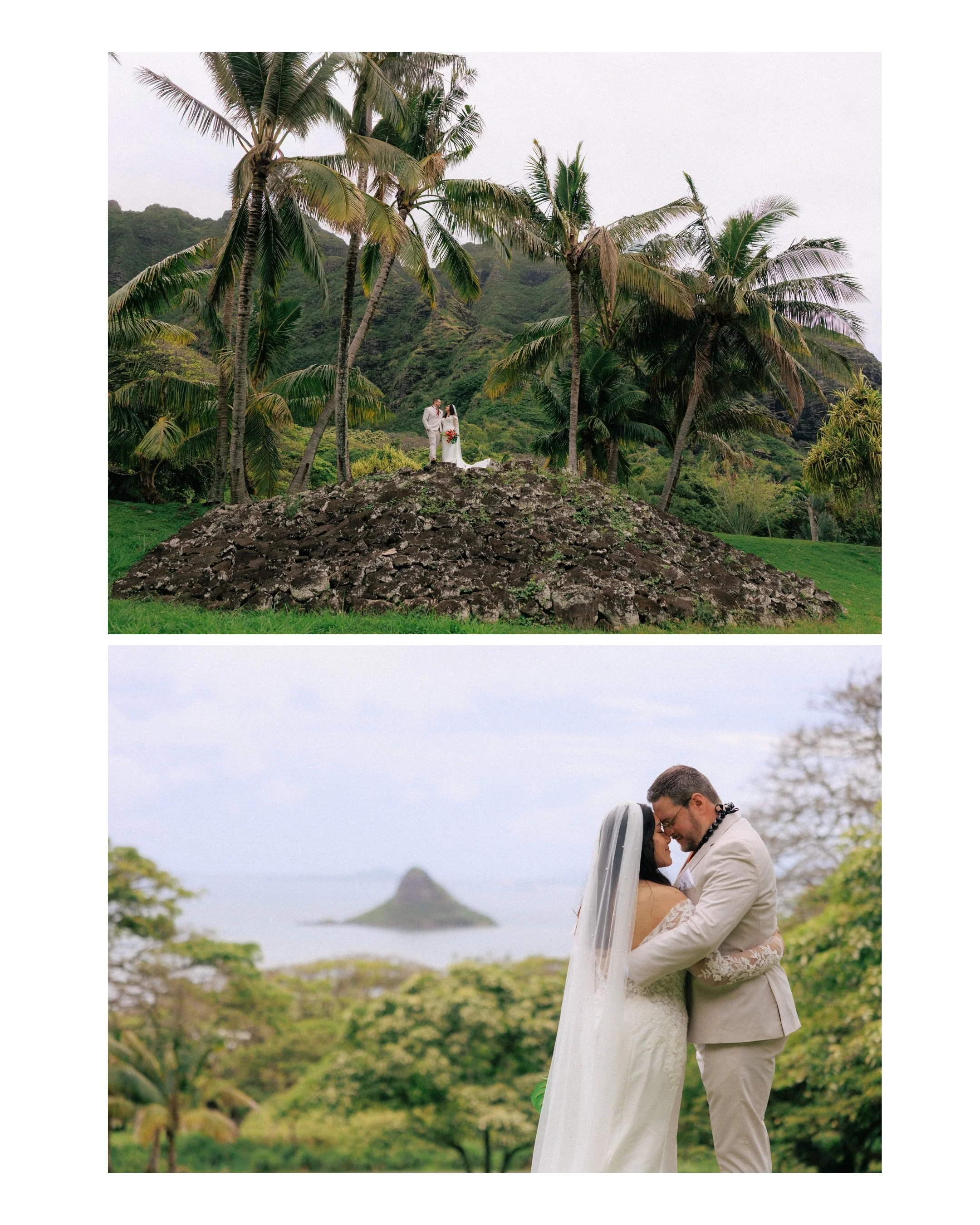 Newlywed couple stands on stone mound surrounded by palm trees at Kualoa Ranch with dramatic mountain backdrop during Oahu wedding portraits.
