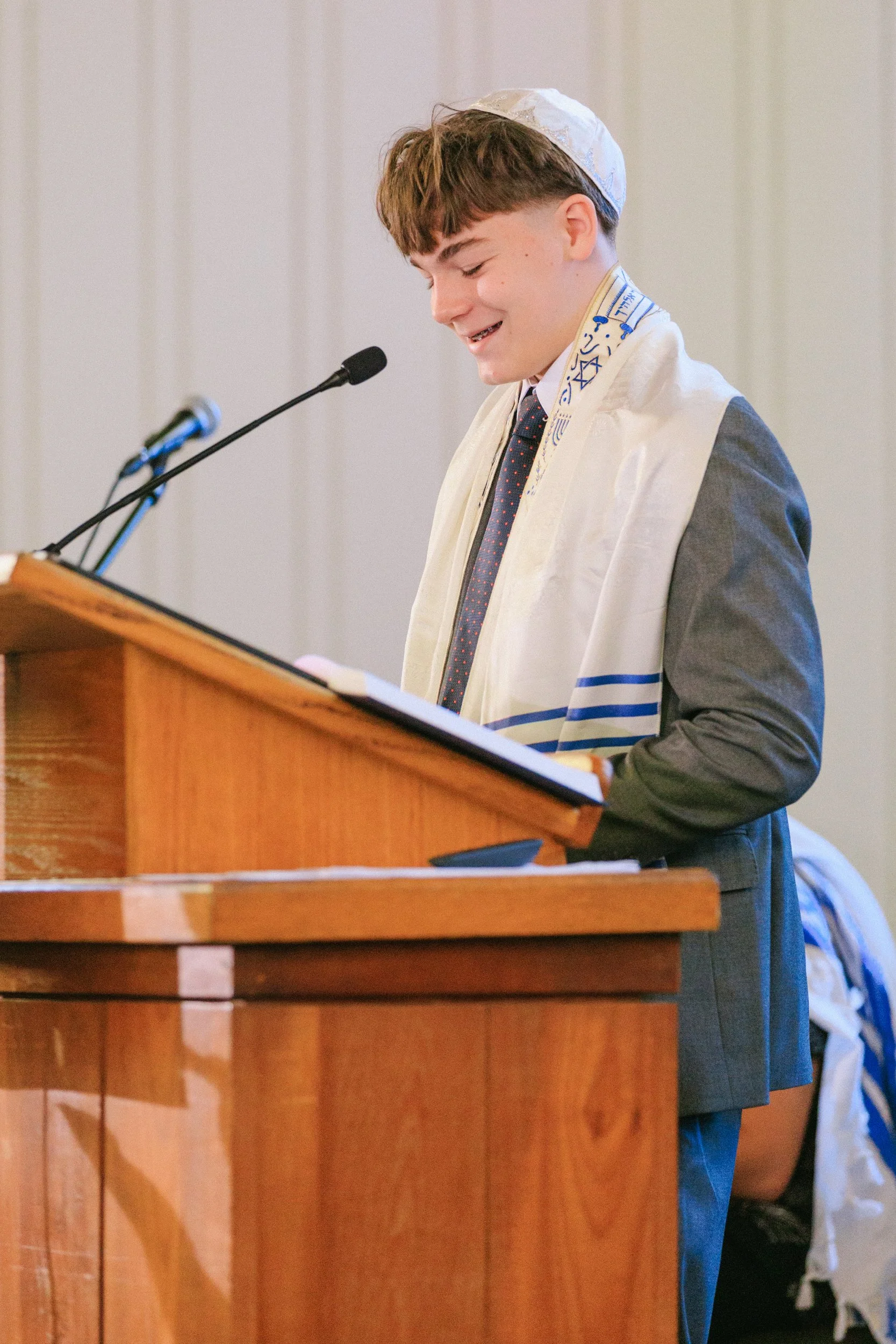 Kevin standing at the bimah during bar mitzvah ceremony Honolulu