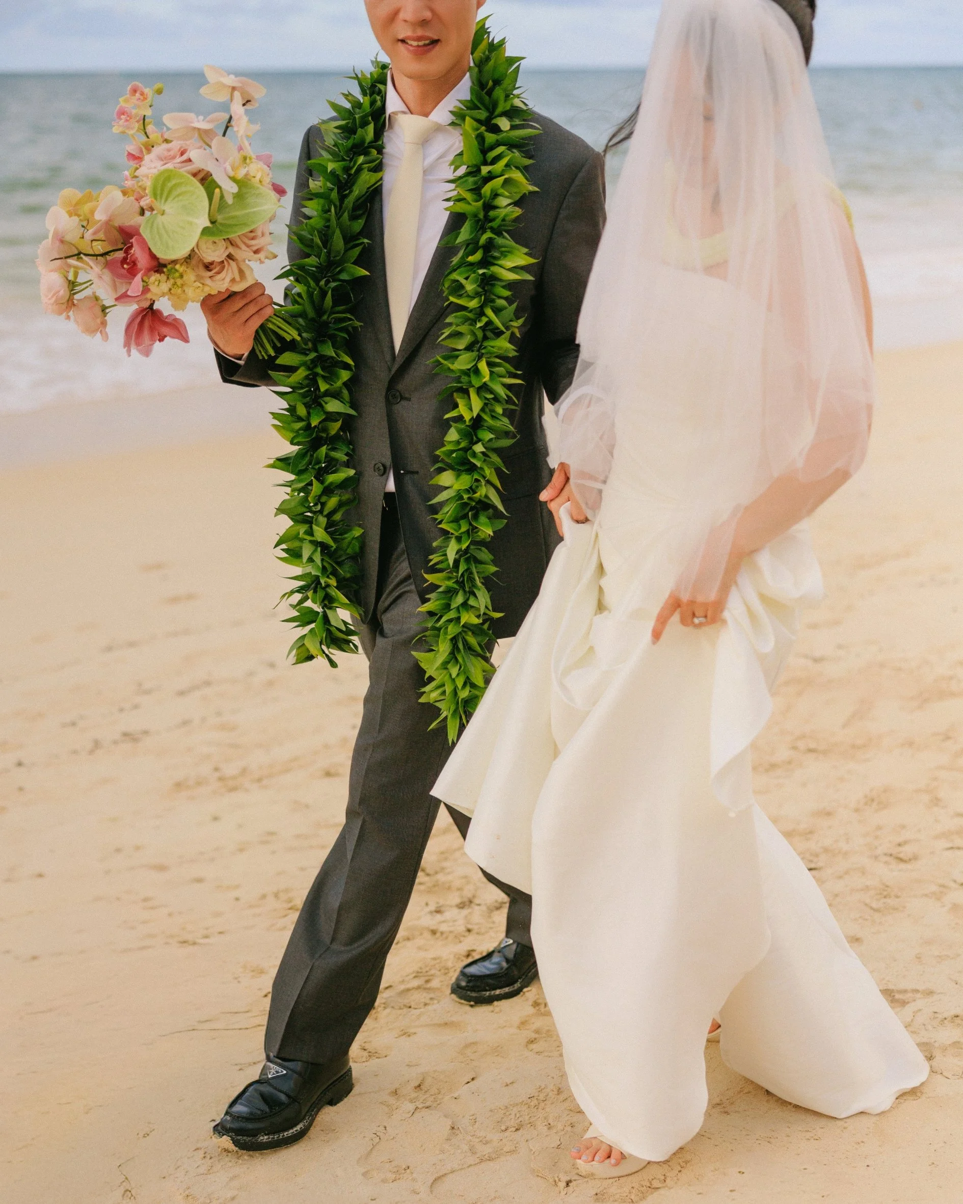 Tiffany and Sungho sharing a quiet moment during their wedding at Male'ana Gardens in Kailua, Oahu