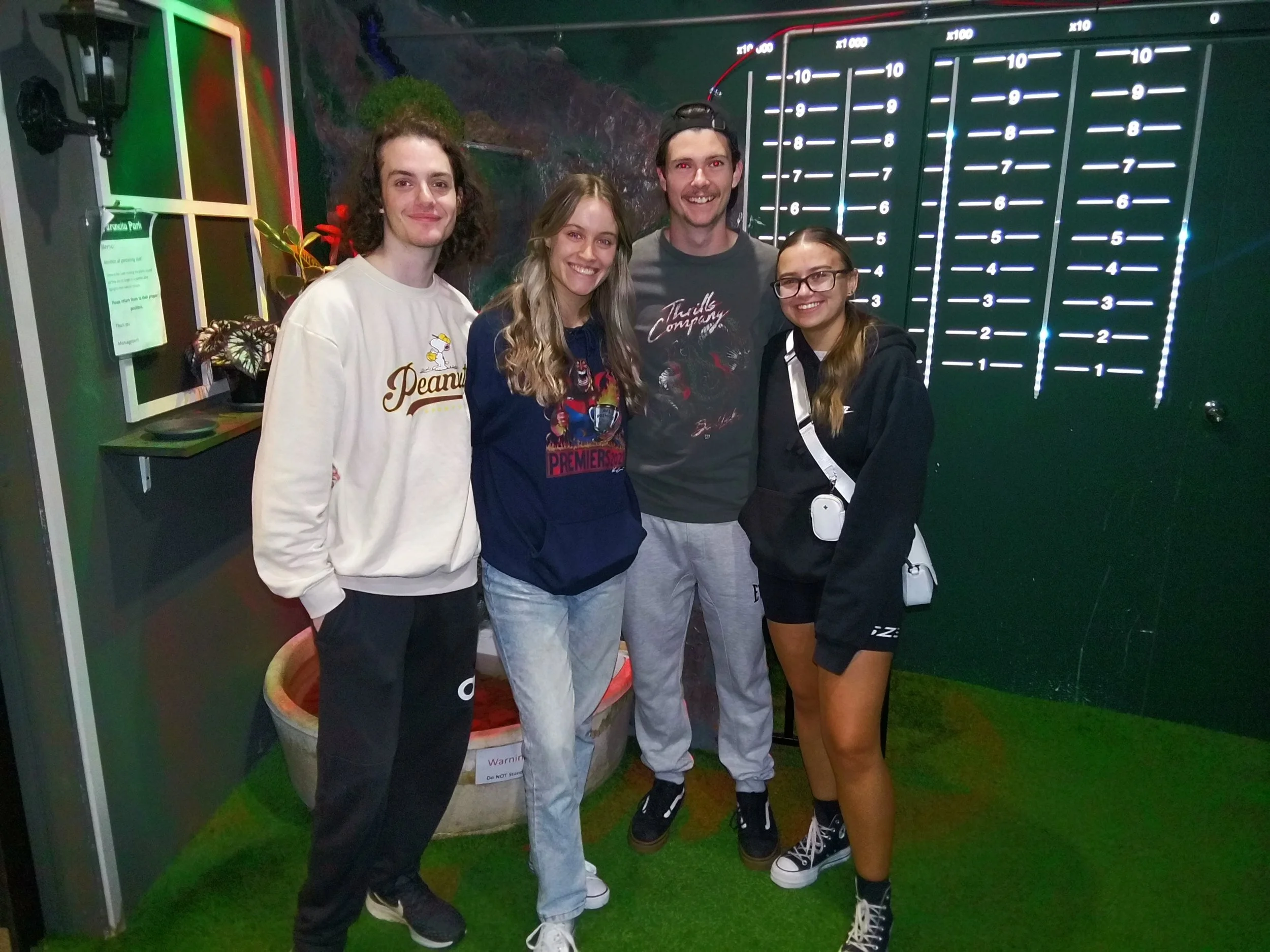 a group of people celebrating their win in the Rainforest Rescue escape room at DropBear escapes in Pakenham