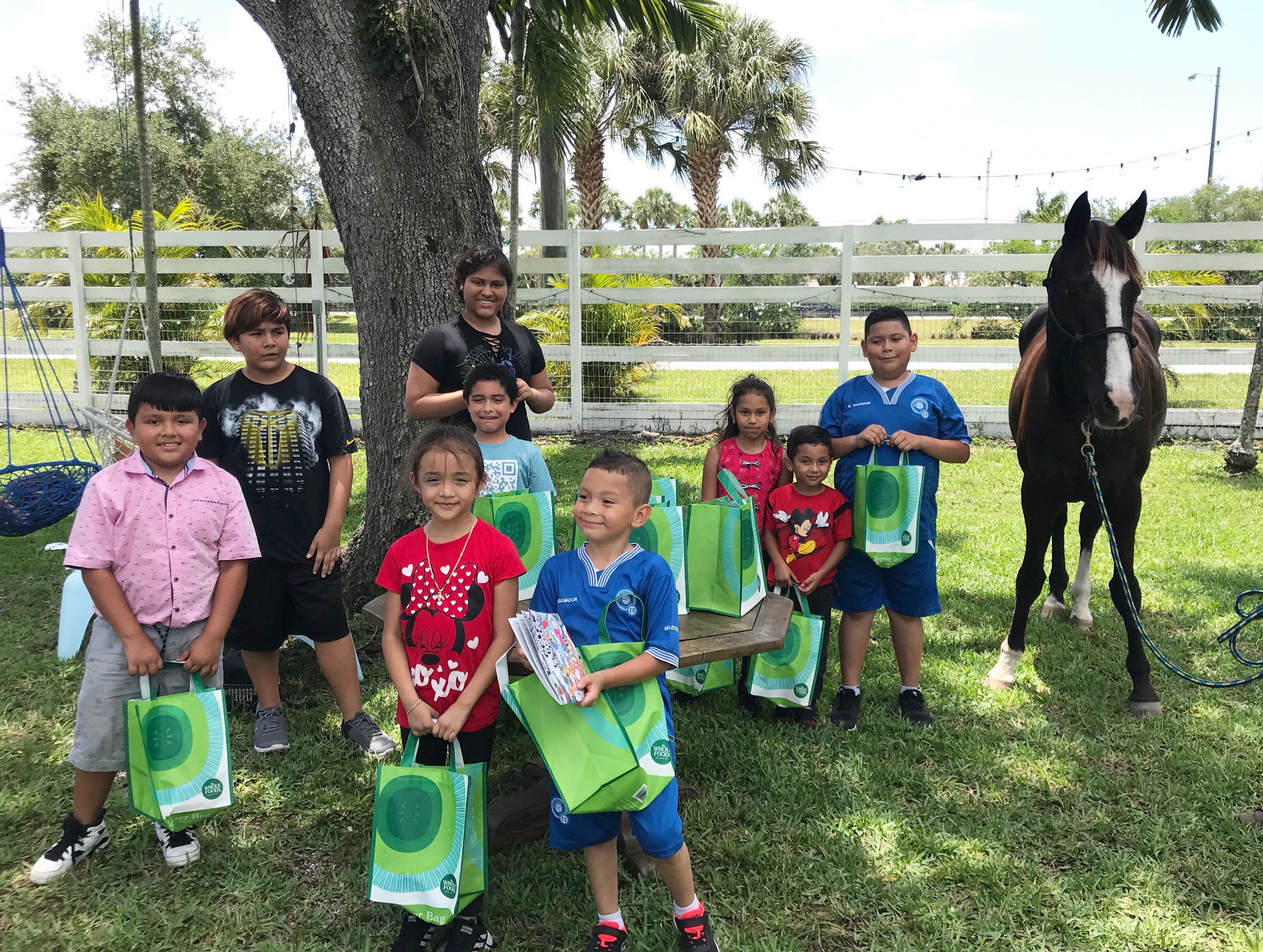 Children and horse with  WF gift bags.jpg