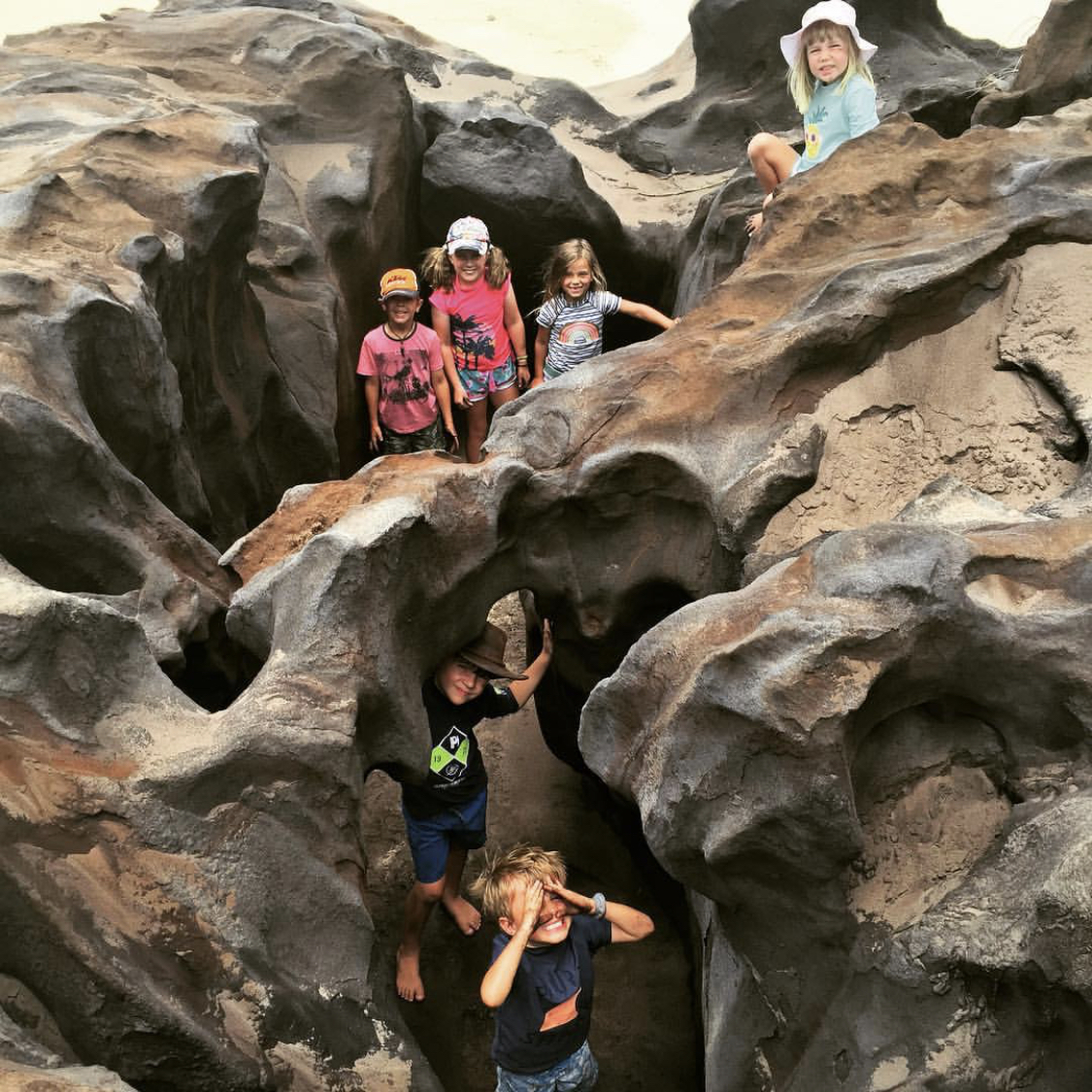 Playing in the ‘coffee’ rocks at Ngala Rocks. The kids will get filthy as coffee rock is very dark and crumbly, but they will have so much fun!