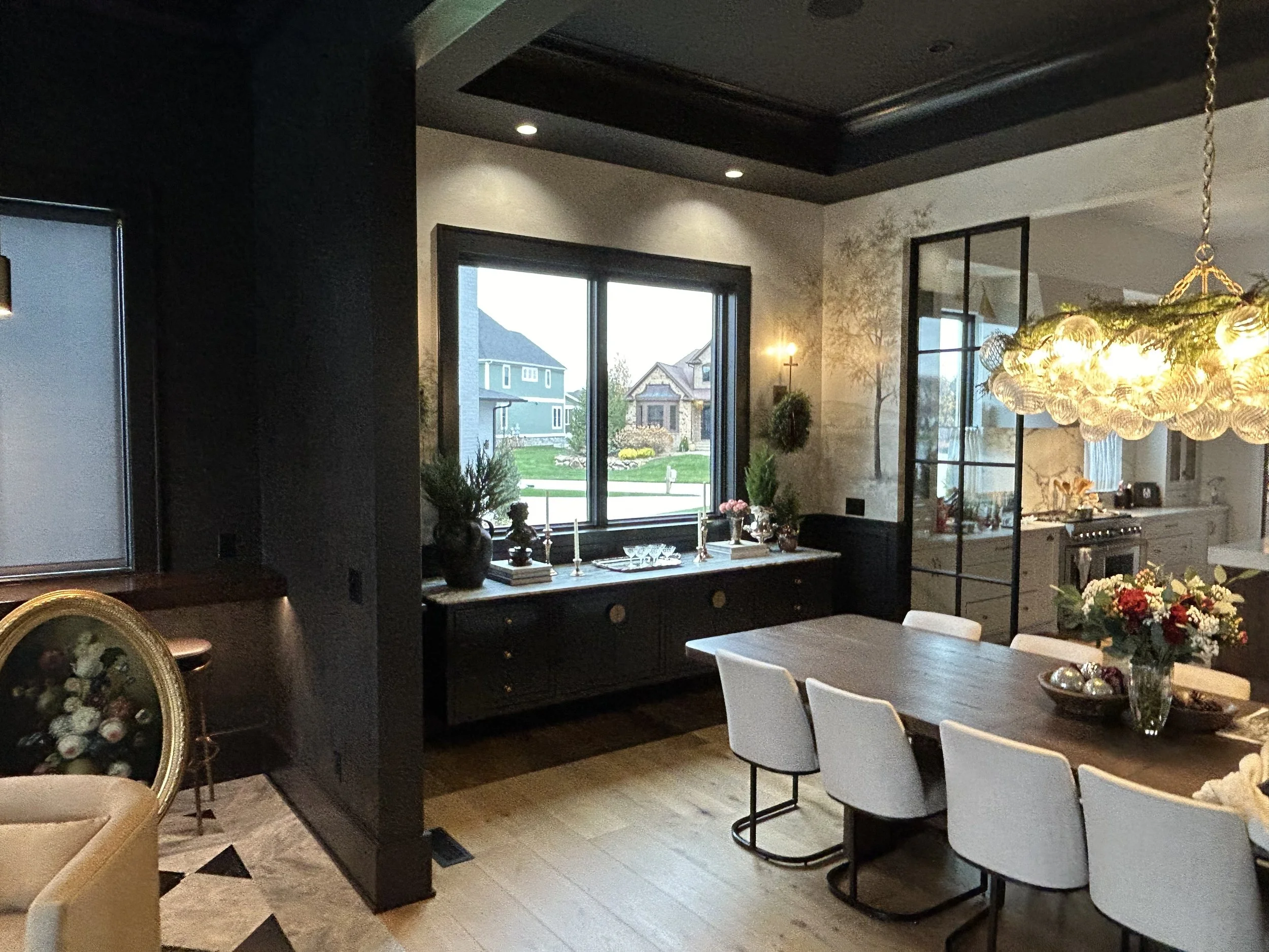 A beautiful contrast between the light bright dining room and dark moody club room. 
