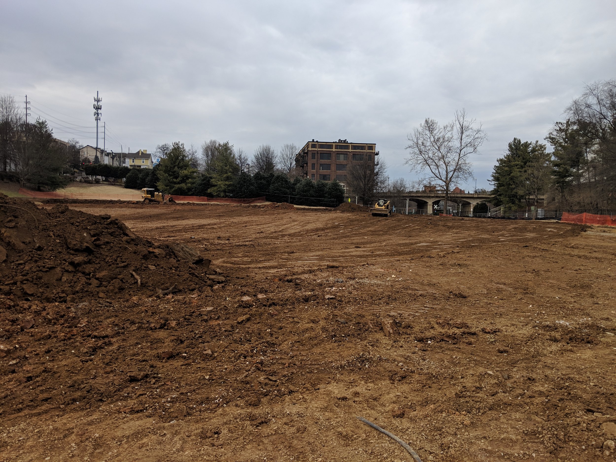 Rough grading preps the site for irrigation and drainage installation.