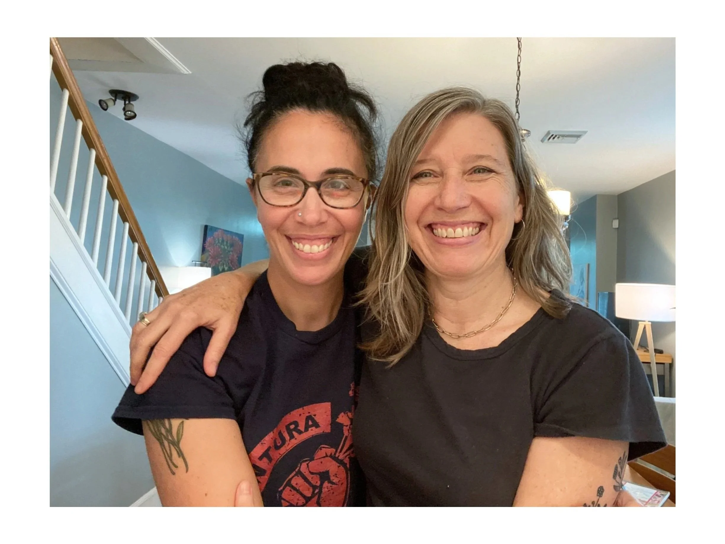 Erin (left) and Ellen (right) smiling like crazy and embracing each other for the selfie.