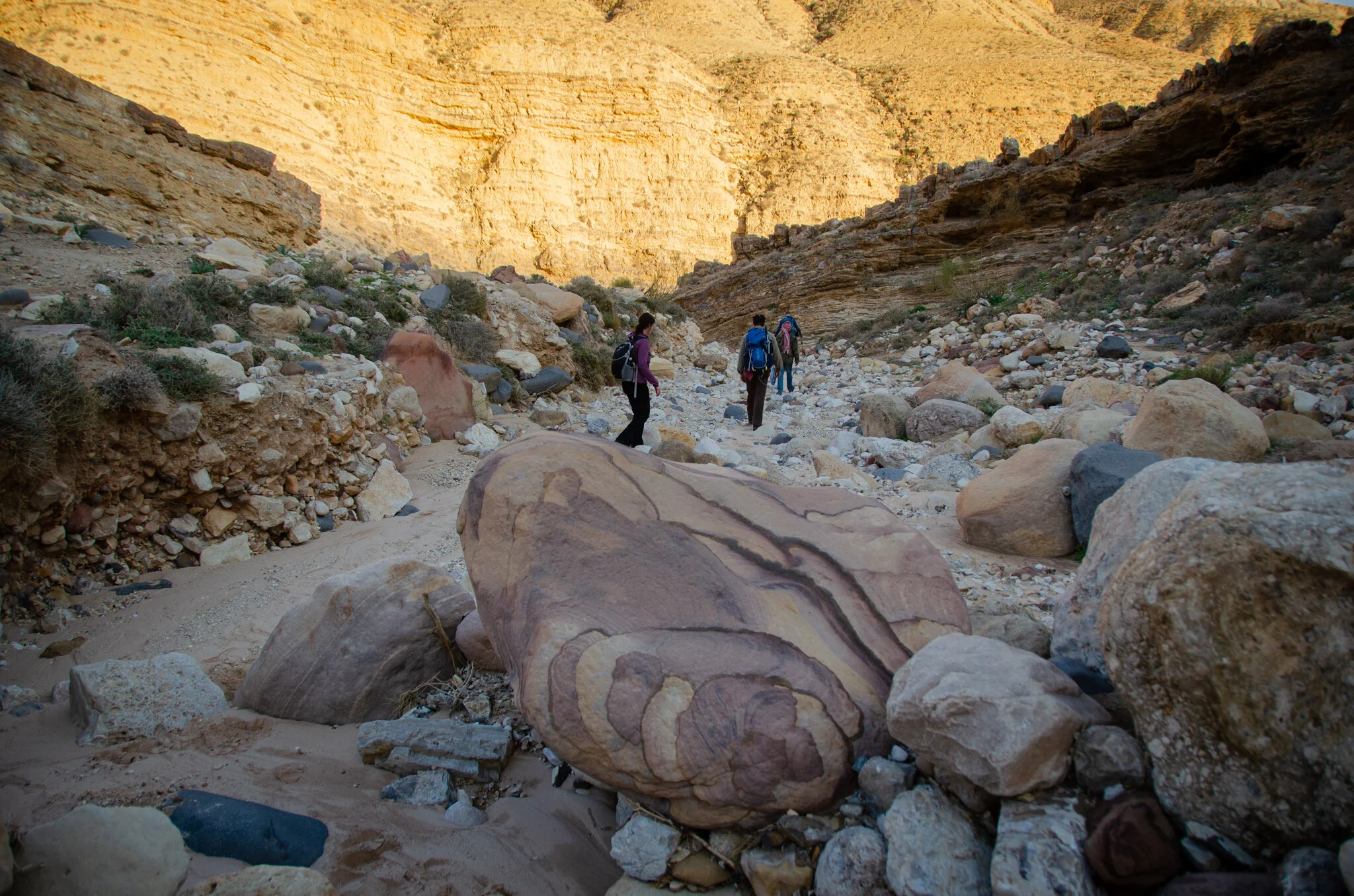 Dropping down into Wadi Al- Nakheel- and hiking along the dry riverbed as the sun went down