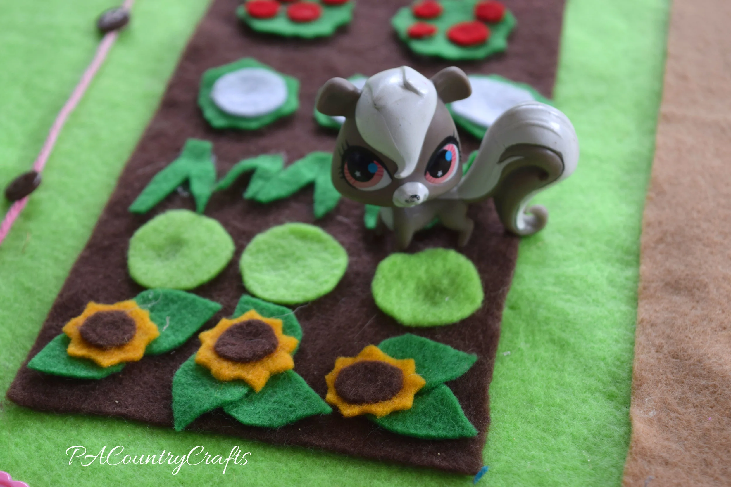 felt sunflowers in a garden