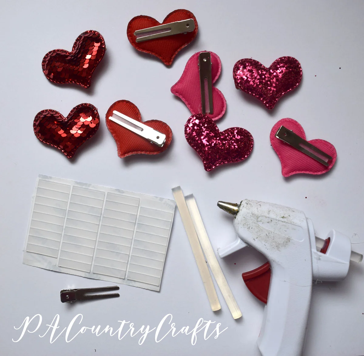 Just hot glue hearts from the Target Dollar Spot to hair clips!