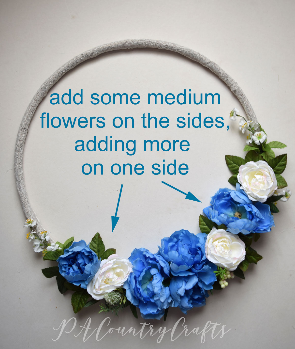 adding-flowers-to-a-hoop-wreath.jpg