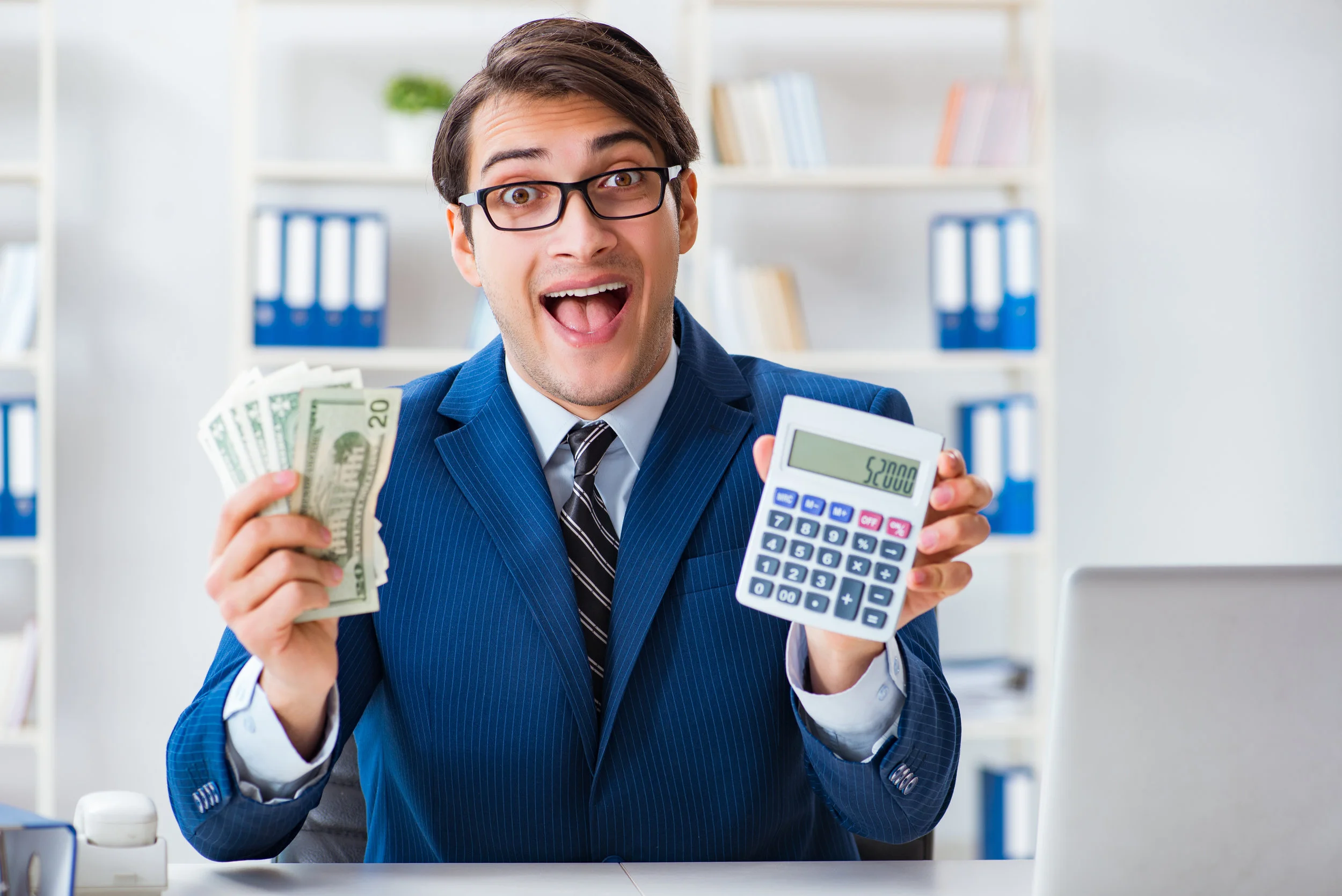Canva - Accountant Calculating Dollars with Calculator in Office-2.jpg
